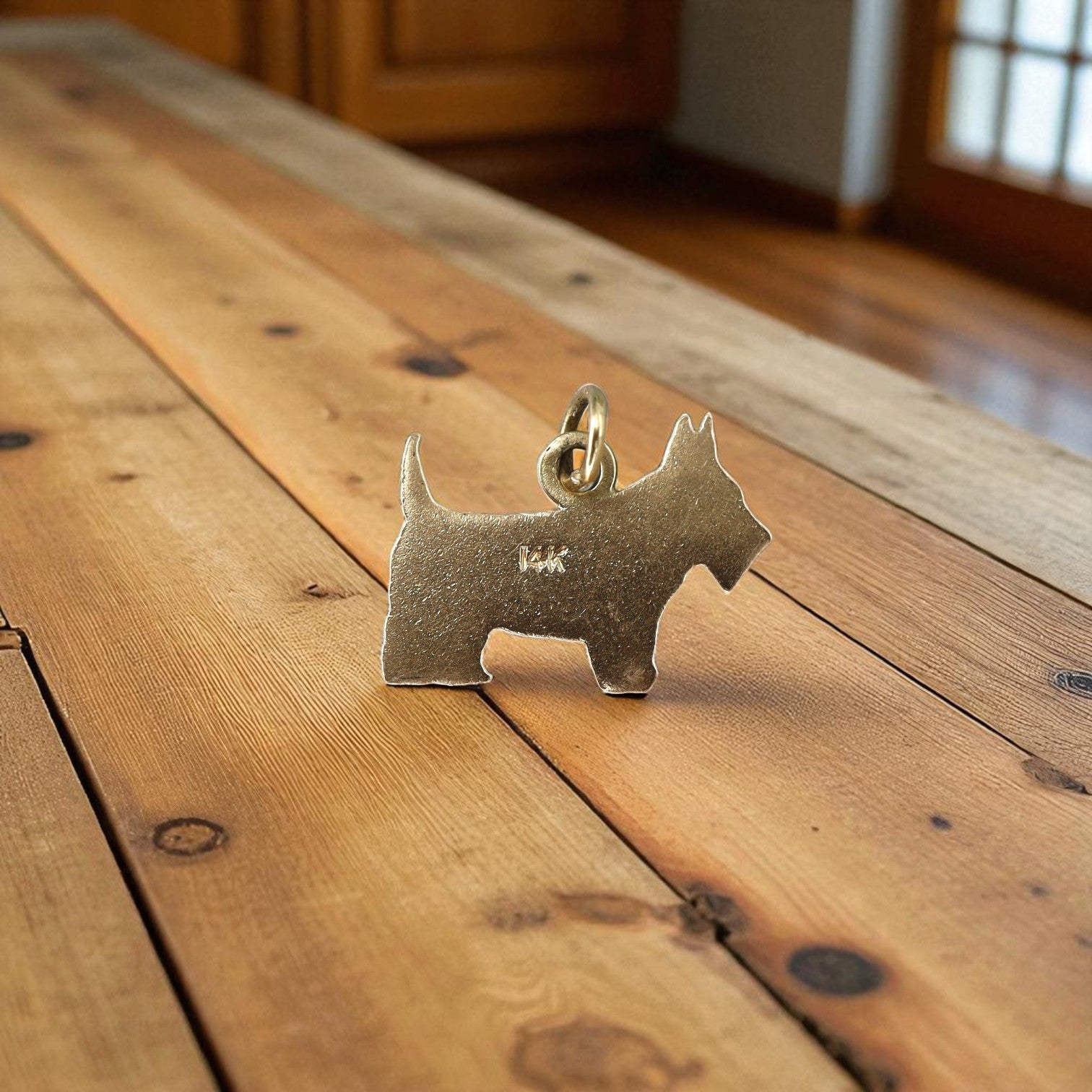 Vintage Scottish Terrier charm in 14k gold, detailed and cute, perfect for jewelry or charm bracelets.