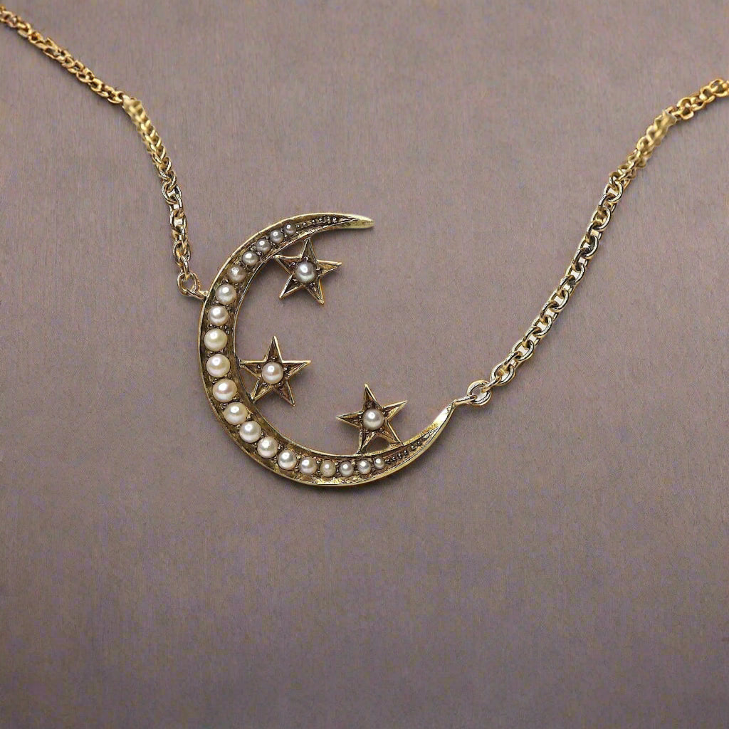 14k yellow gold Victorian crescent moon and star necklace with pearl accents, featuring a delicate and elegant design.