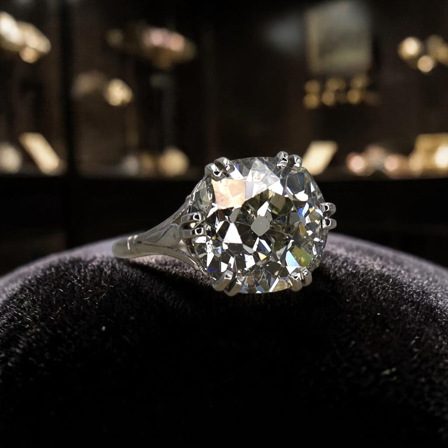 Vintage Edwardian platinum solitaire engagement ring with 7.57ct old mine cut diamond from the Petra Star Vault Collection.