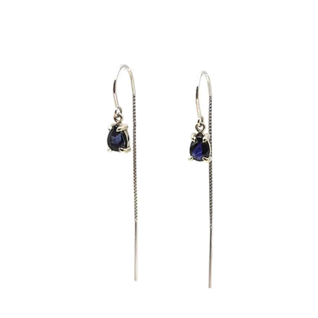Sapphire threader earrings in 14k white gold with blue sapphires, featuring delicate dangle design by Petra Star