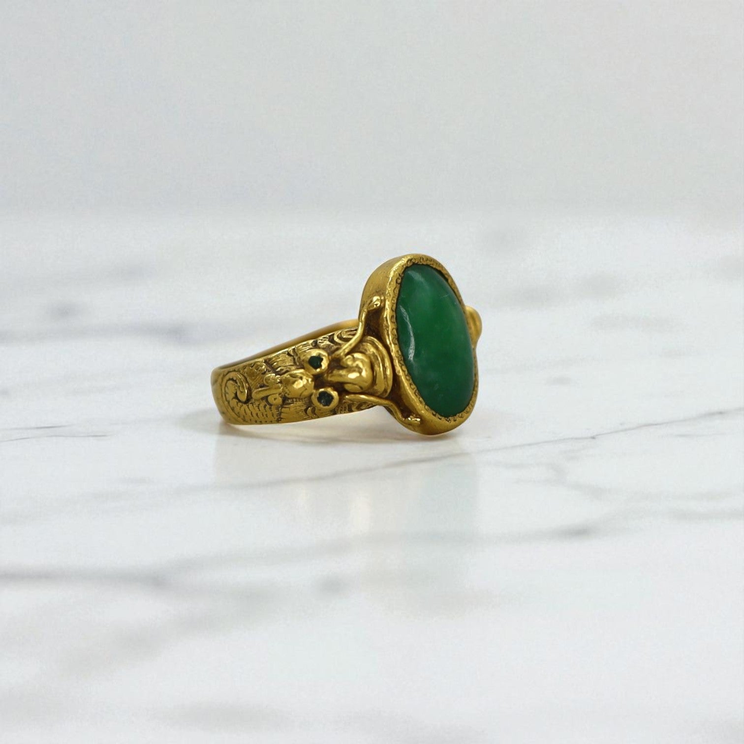 Art Nouveau Chinese jade ring featuring intricate design and 24k gold accents, crafted by The Vintage Vault.