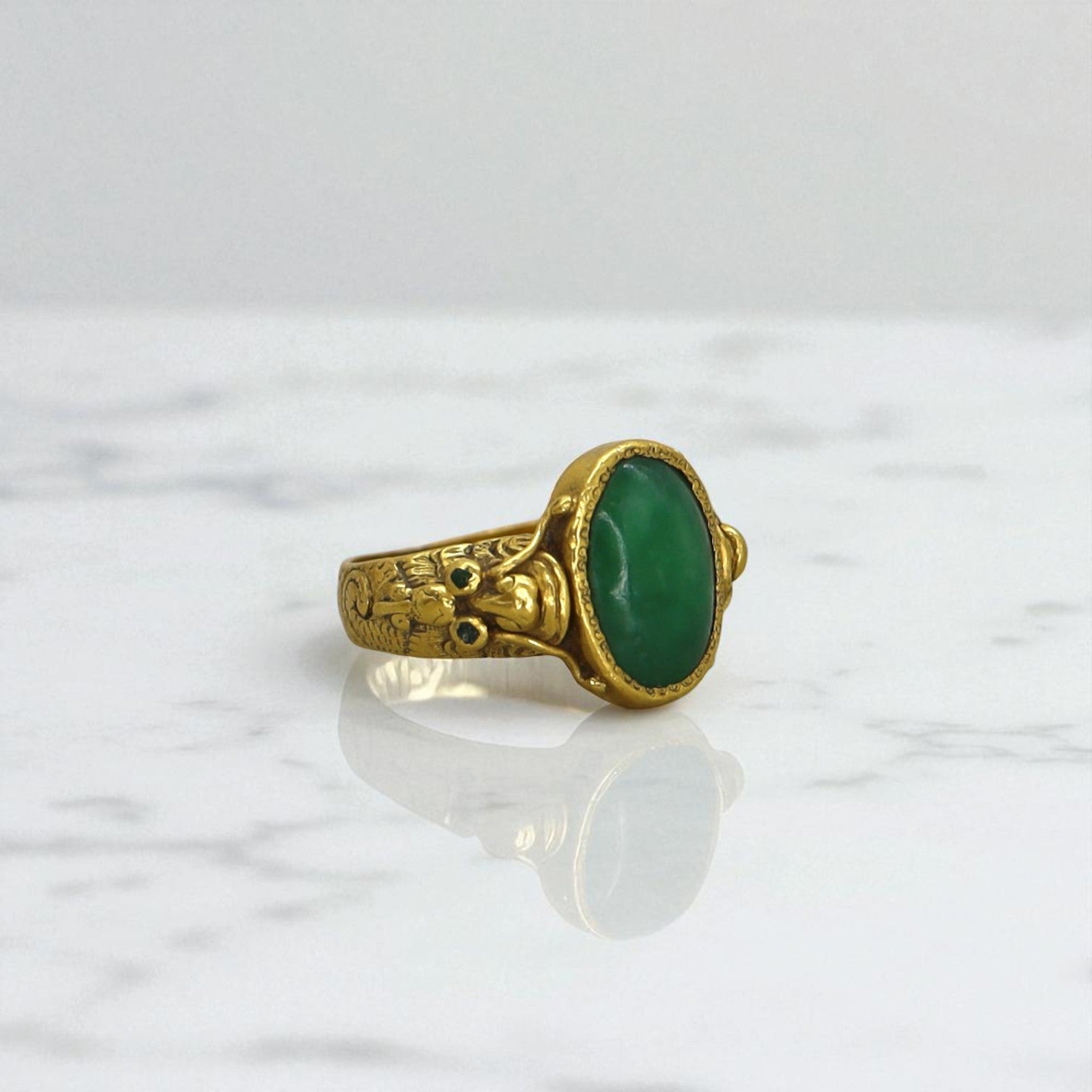 Art Nouveau Chinese jade ring with 24k gold accents, showcasing intricate design and vibrant green jade stone.