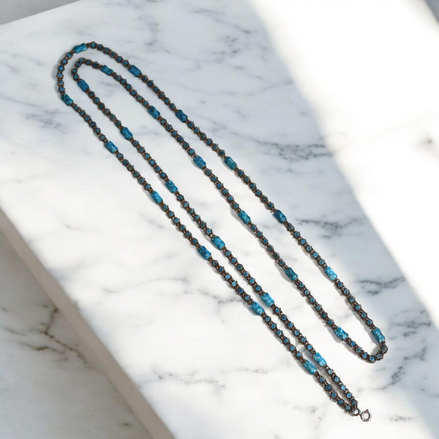 Art Nouveau Guilloche enamel muff chain necklace featuring intricate design and vibrant colors, crafted by The Vintage Vault.