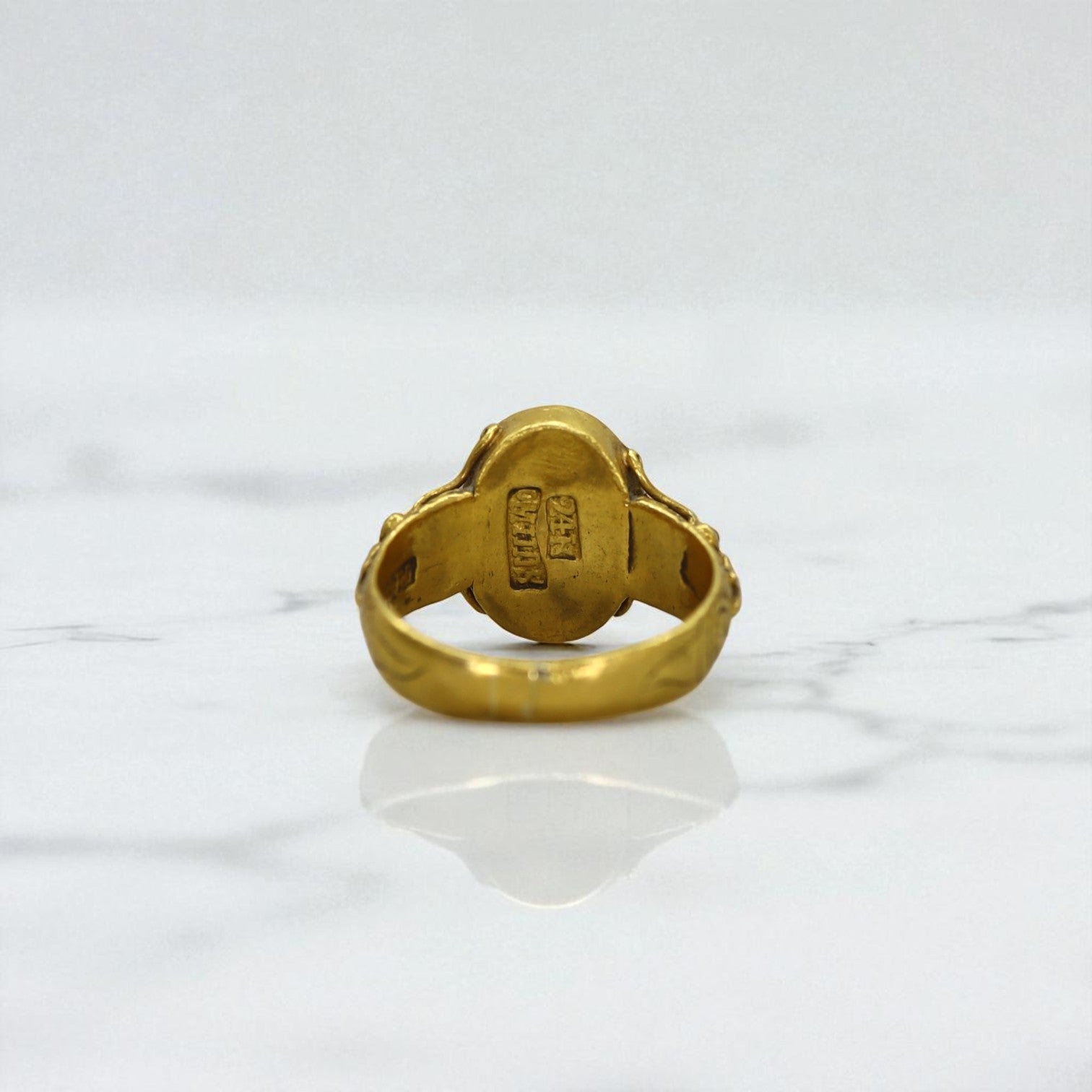 Art Nouveau Chinese jade ring with 24k gold accents, featuring intricate design and polished green jade stone.