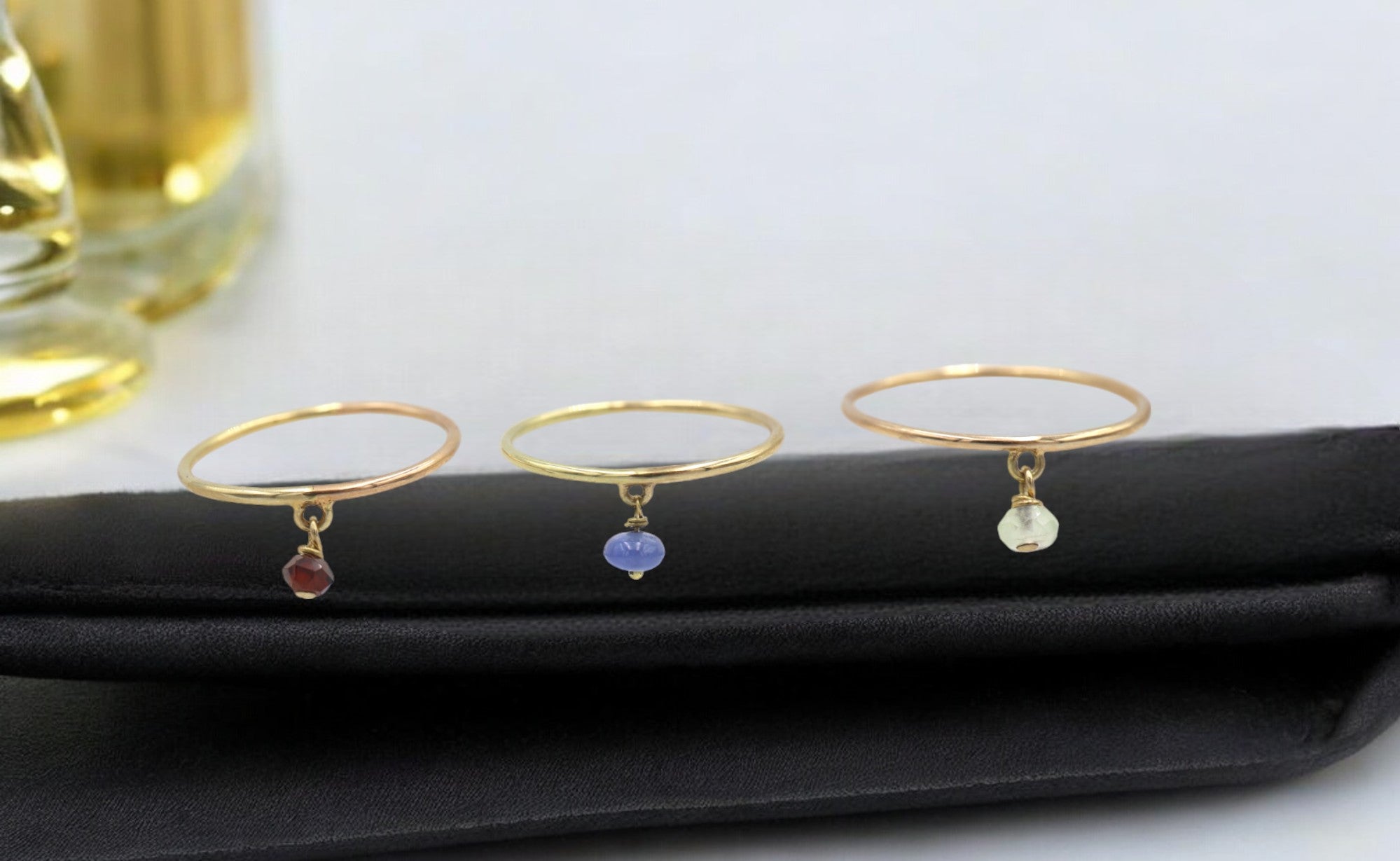 14k gold birthstone ring with a colorful gemstone charm, featuring a sleek band from Petra Star.