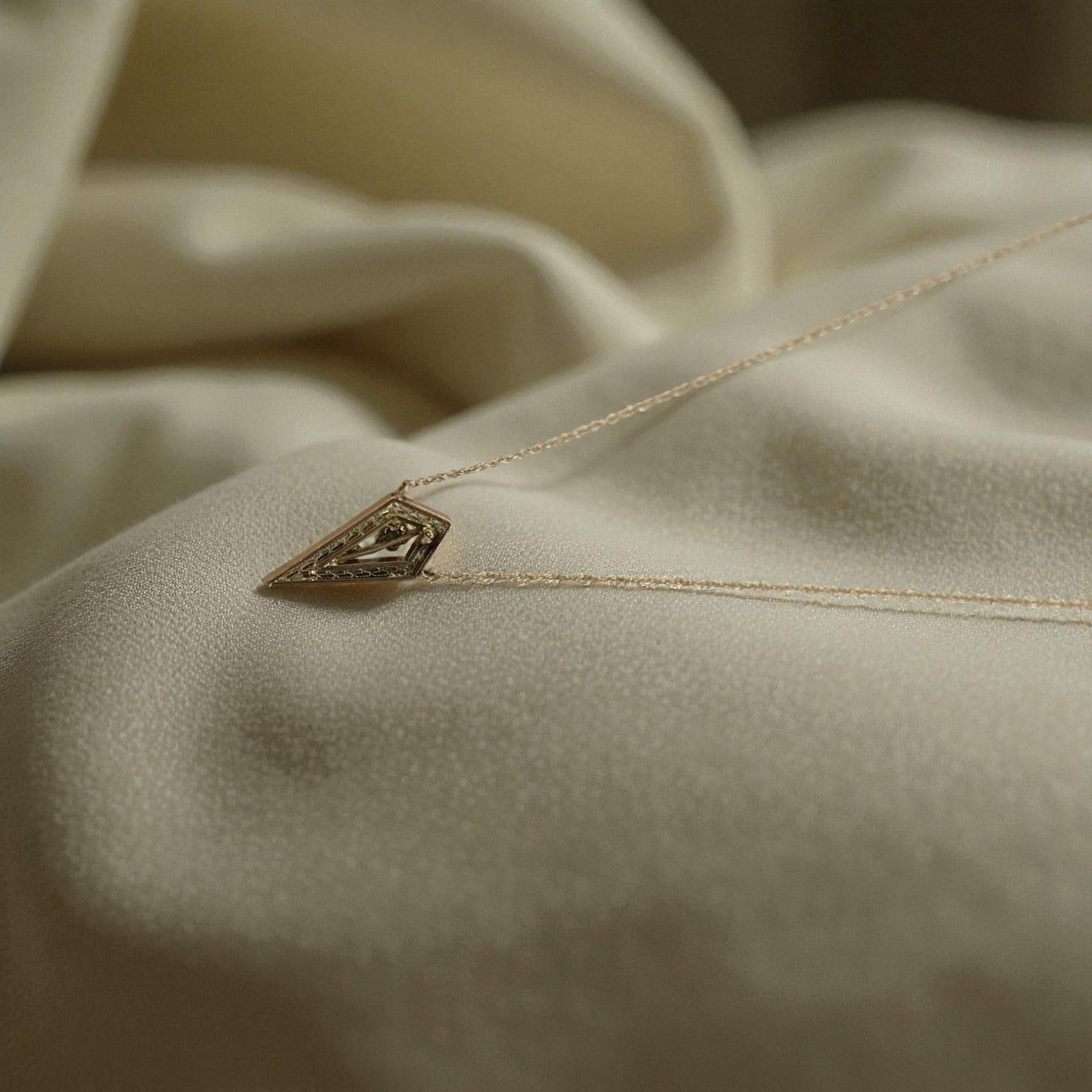 Art Deco diamond stickpin conversion necklace featuring intricate cannetille design by The Vintage Vault.