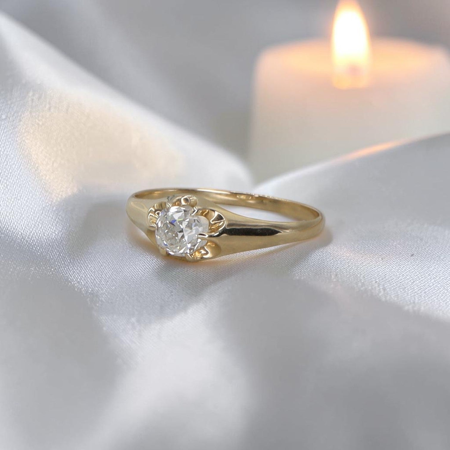 Petra Star engagement ring set featuring a diamond belcher band with antique old mine cut diamond details.