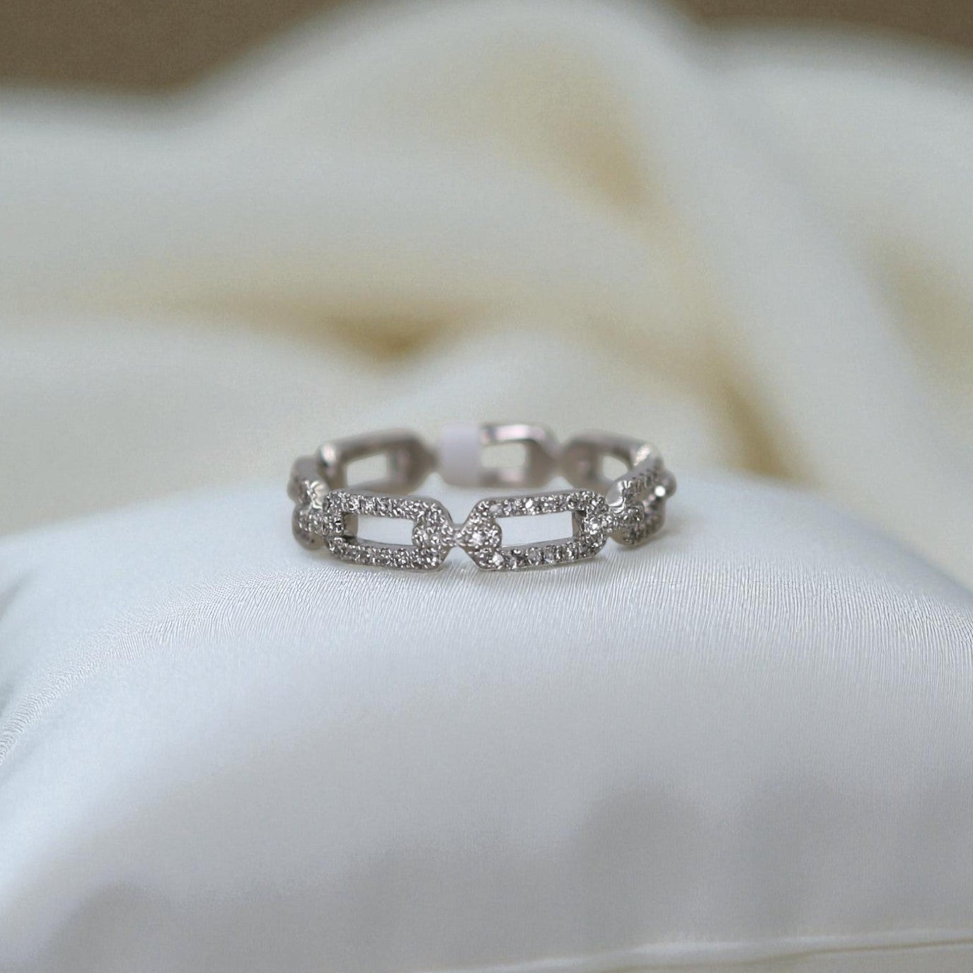 14k white gold diamond link band by Dilamani, showcasing a sleek design with sparkling diamonds and intricate link details.