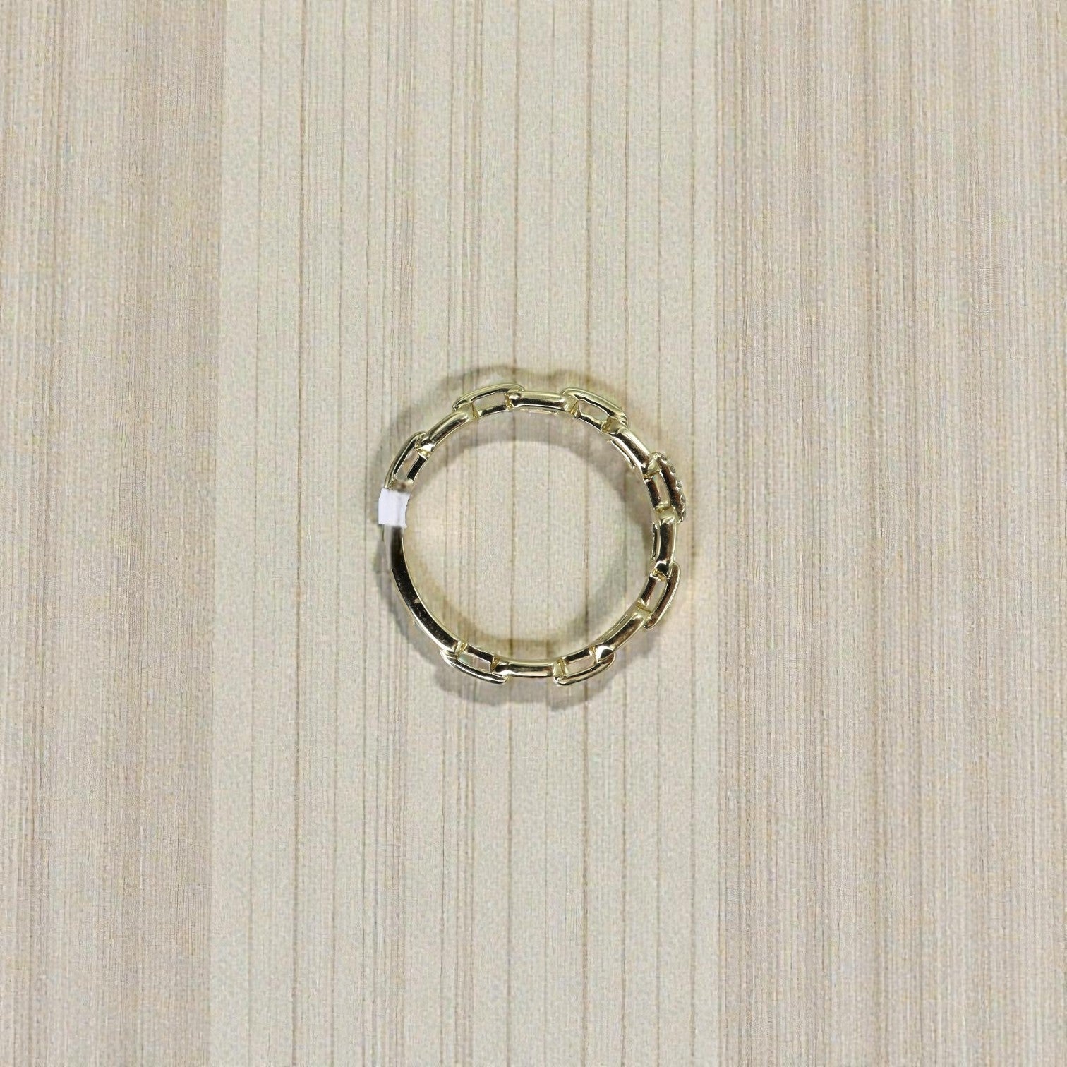 14k yellow gold diamond link band with 0.02ct diamonds, crafted by Dilamani, showcasing a sleek, elegant jewelry design