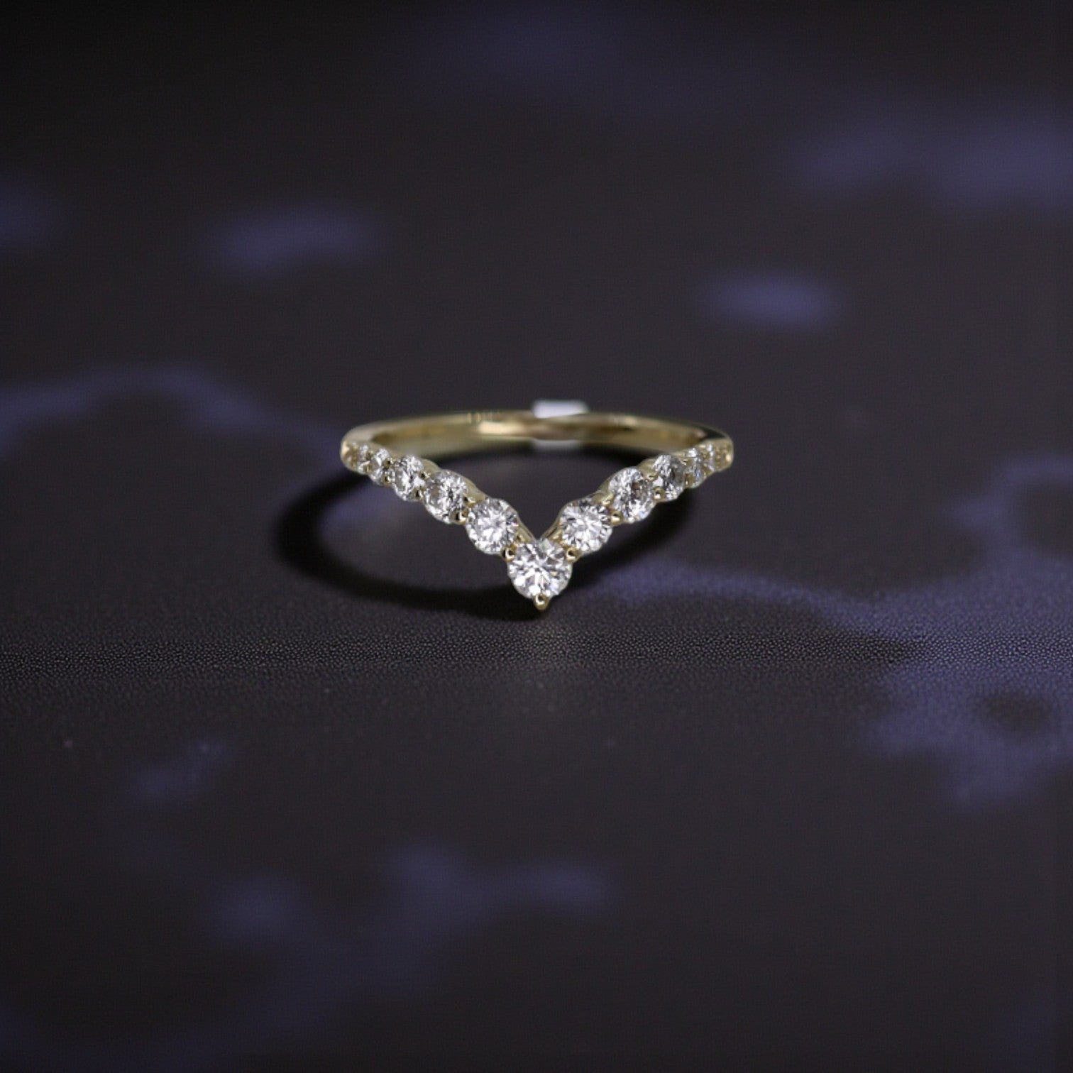 14k yellow gold diamond V-shaped band with 0.64 cts graduated diamonds, elegant jewelry by Dilamani
