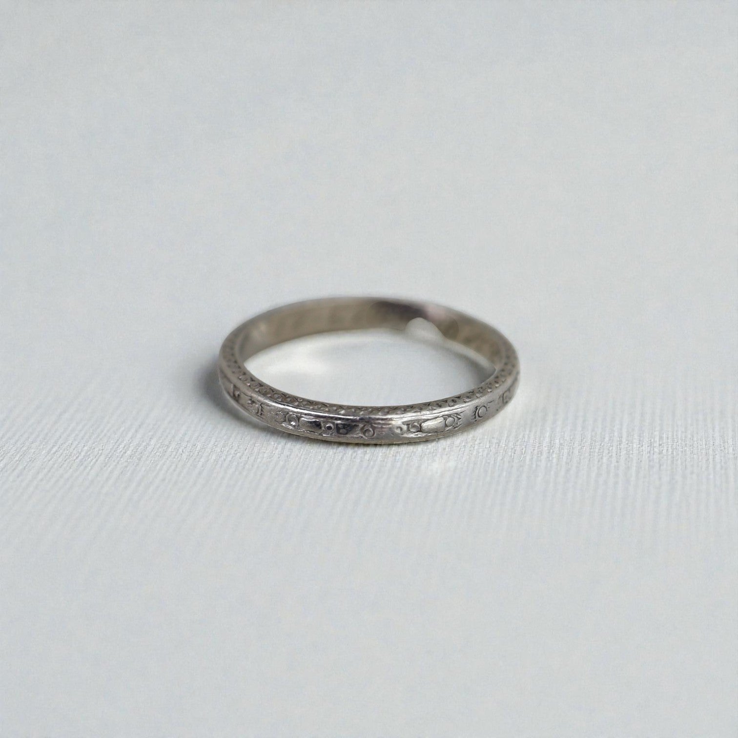 Art Deco platinum band dated 11.28.23, size 6, with intricate vintage design from The Vintage Vault.
