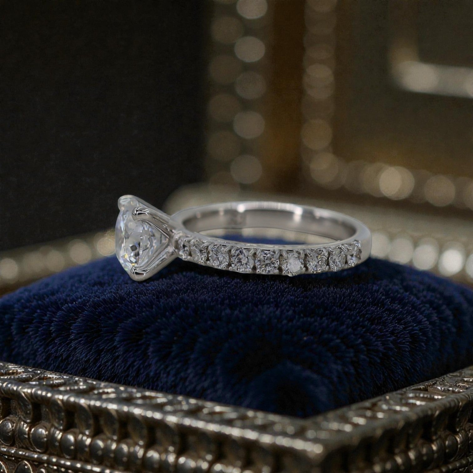 Petra Star shared prong engagement ring remount featuring a sleek band and prong setting for a secure, elegant display of a gemstone.