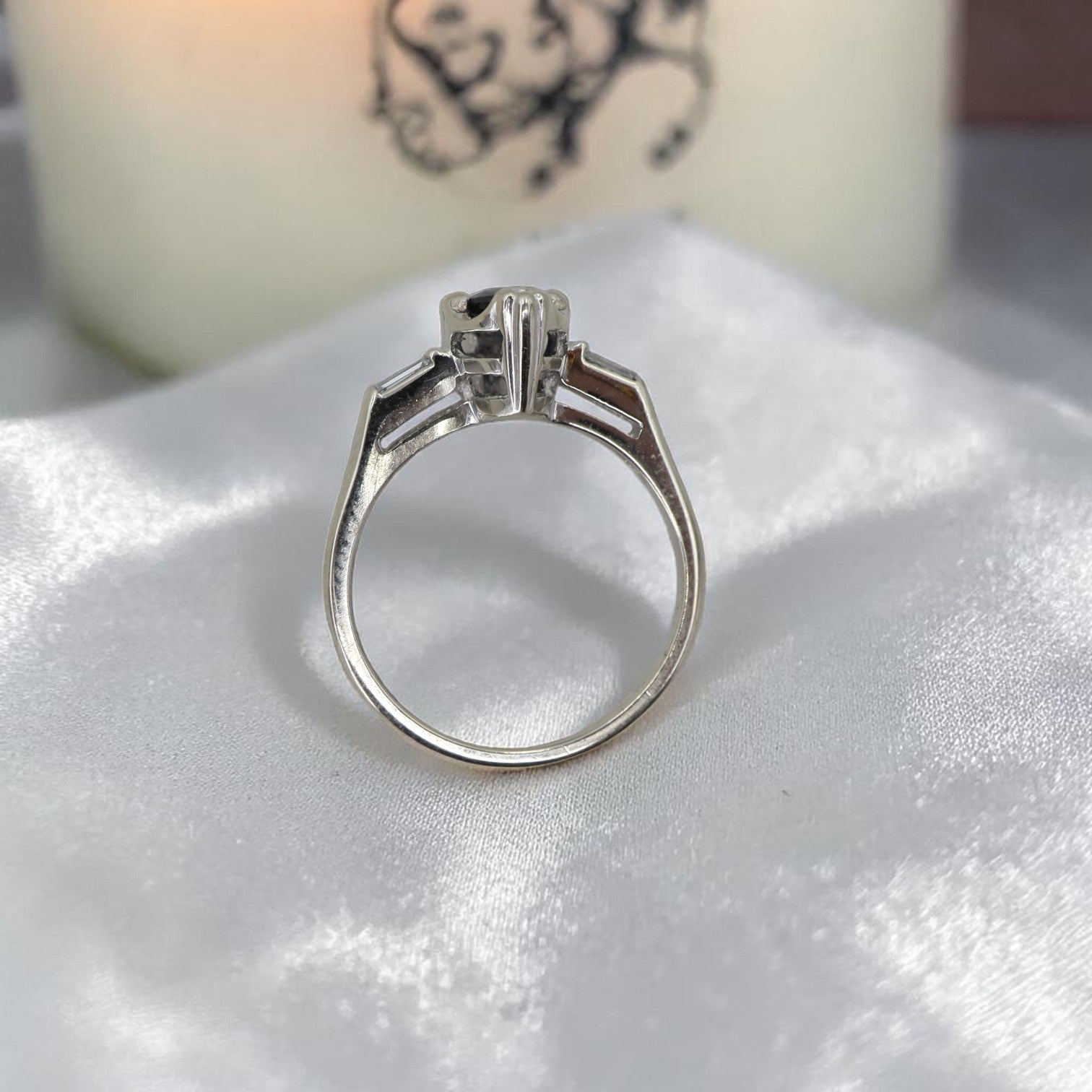 Marquise teal sapphire engagement ring with channel-set baguette diamonds in 14k white gold, featuring intricate vintage design.