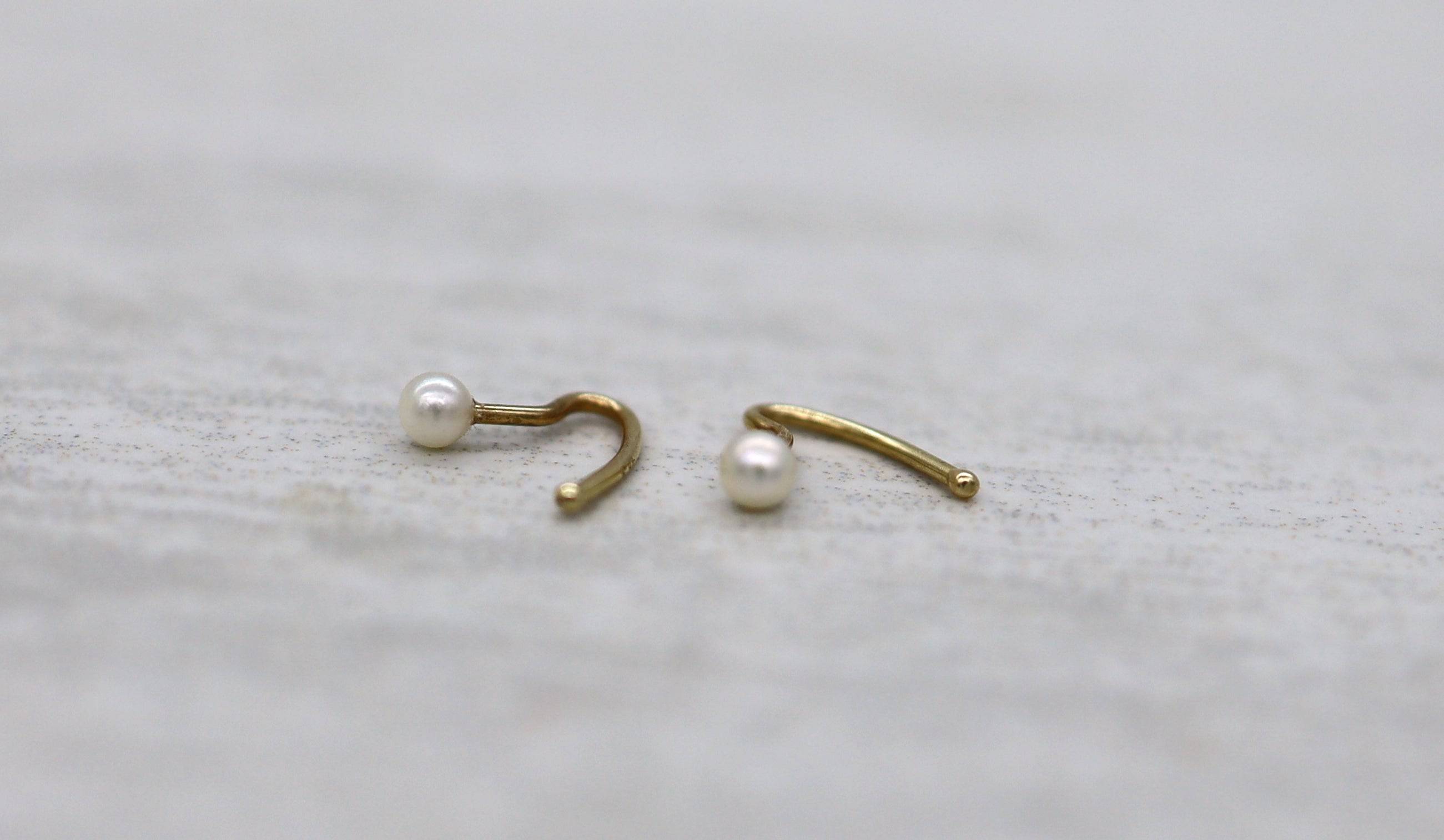 Pearl nose ring earrings by Petra Star featuring a delicate pearl design for subtle, elegant nose piercing adornment.