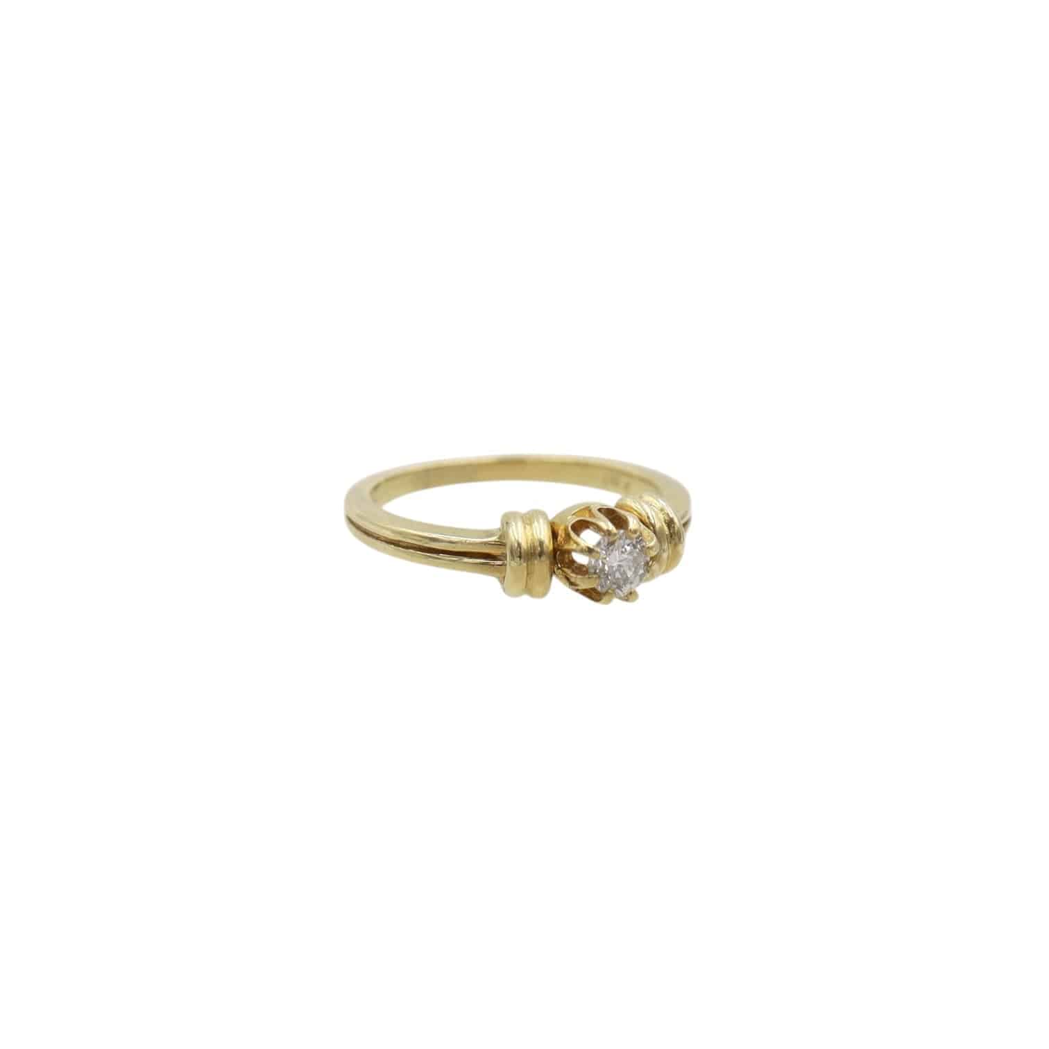 Vintage Vault mid-century diamond engagement ring with a sleek band and sparkling center diamond on a white background.