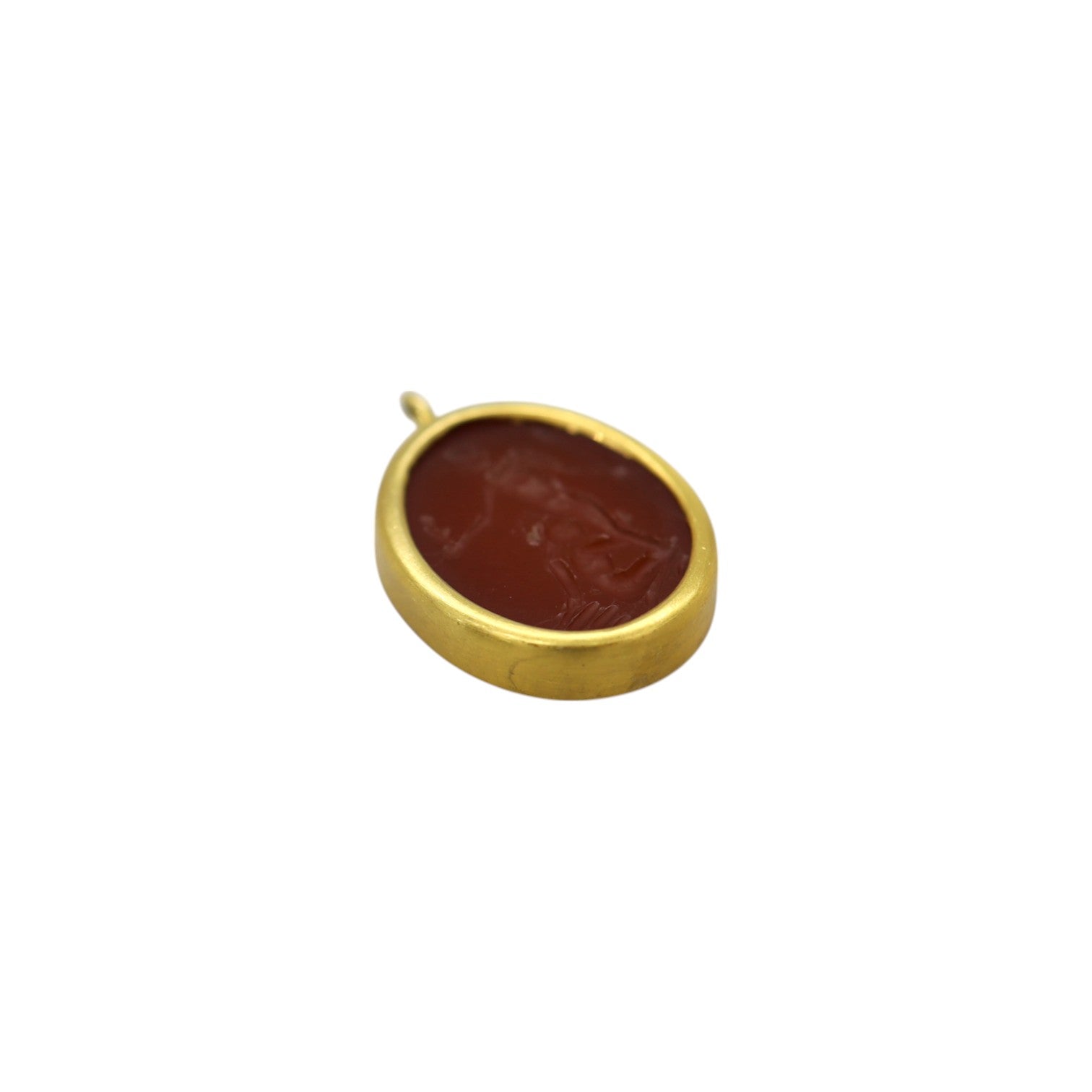 Antique carnelian erotic intaglio pendant in 14k gold featuring detailed carved imagery, vintage jewelry piece.