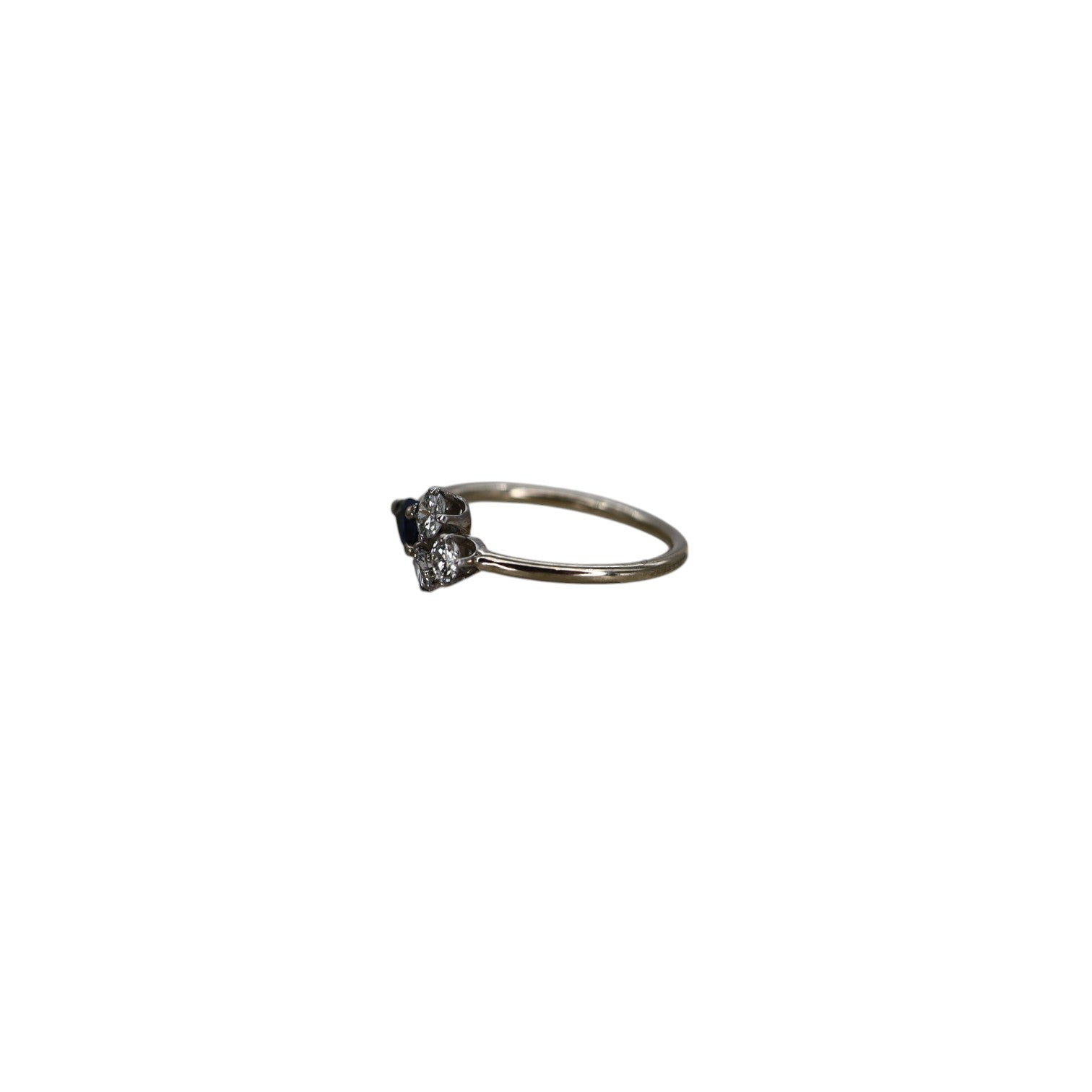 Petra Star quatrefoil sapphire and diamond ring featuring a central sapphire surrounded by sparkling diamonds on a silver band.