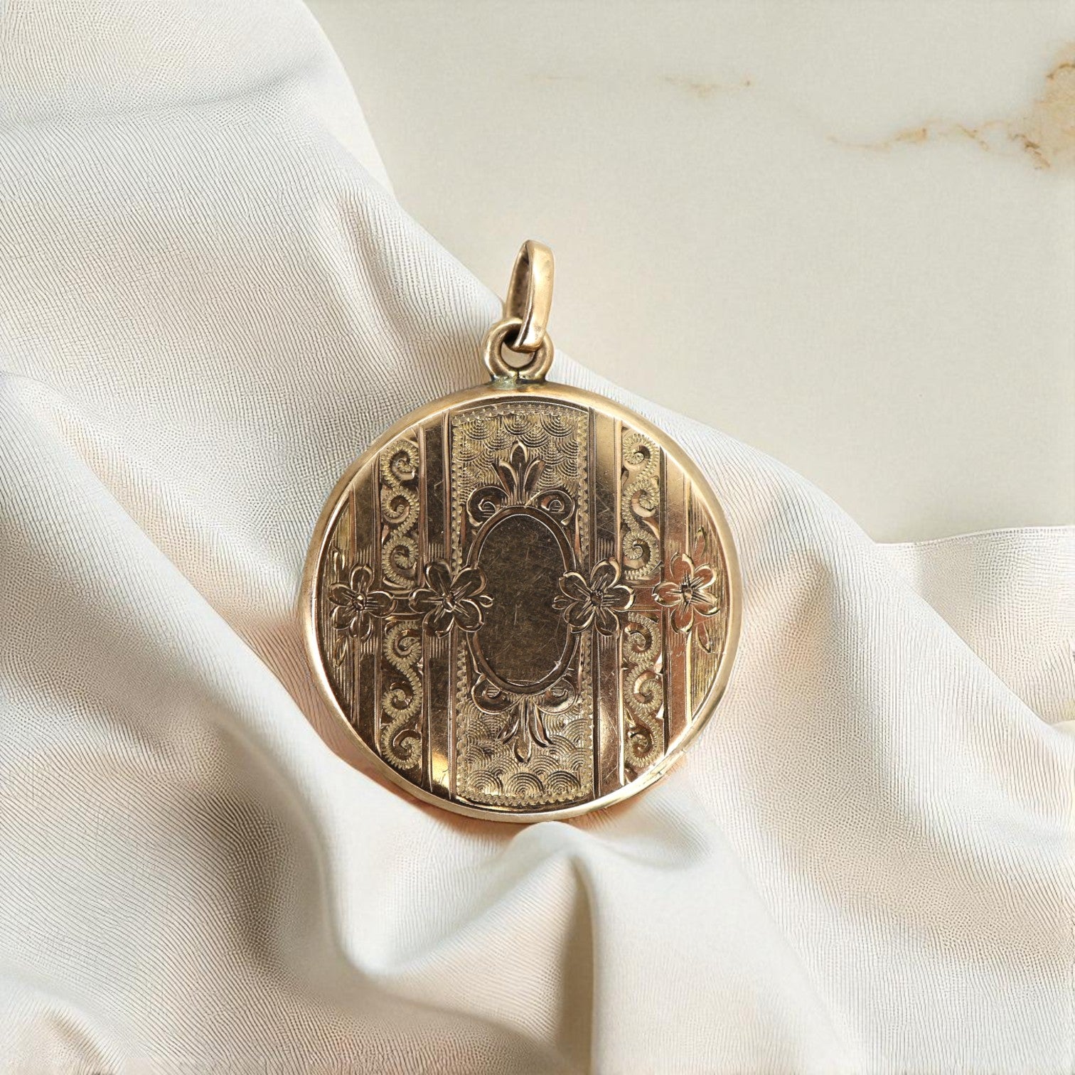 Victorian gold-filled pendant locket with intricate detailing, featuring vintage-inspired craftsmanship from The Vintage Vault.