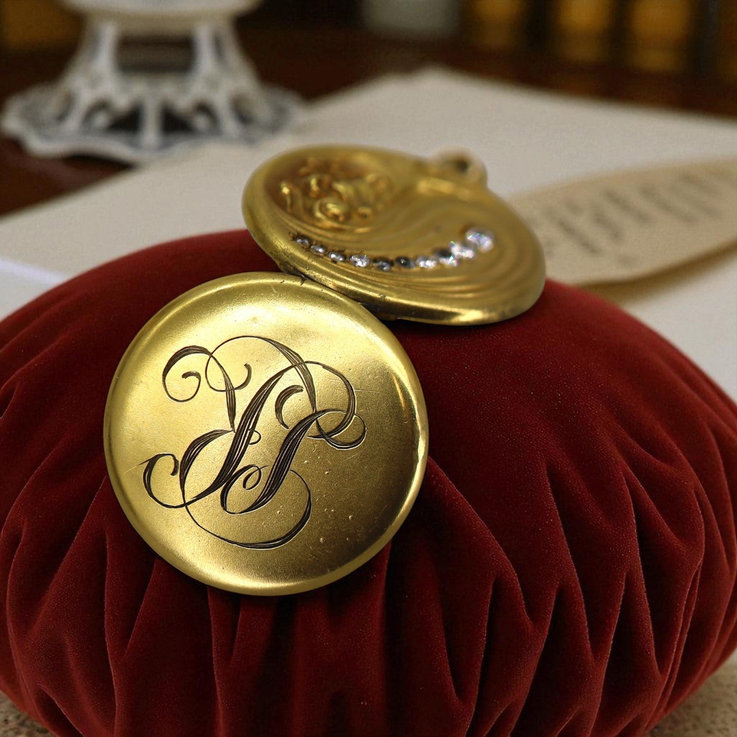 Art Nouveau gold locket pendant with monogram LRC, featuring intricate vintage design, by The Vintage Vault.