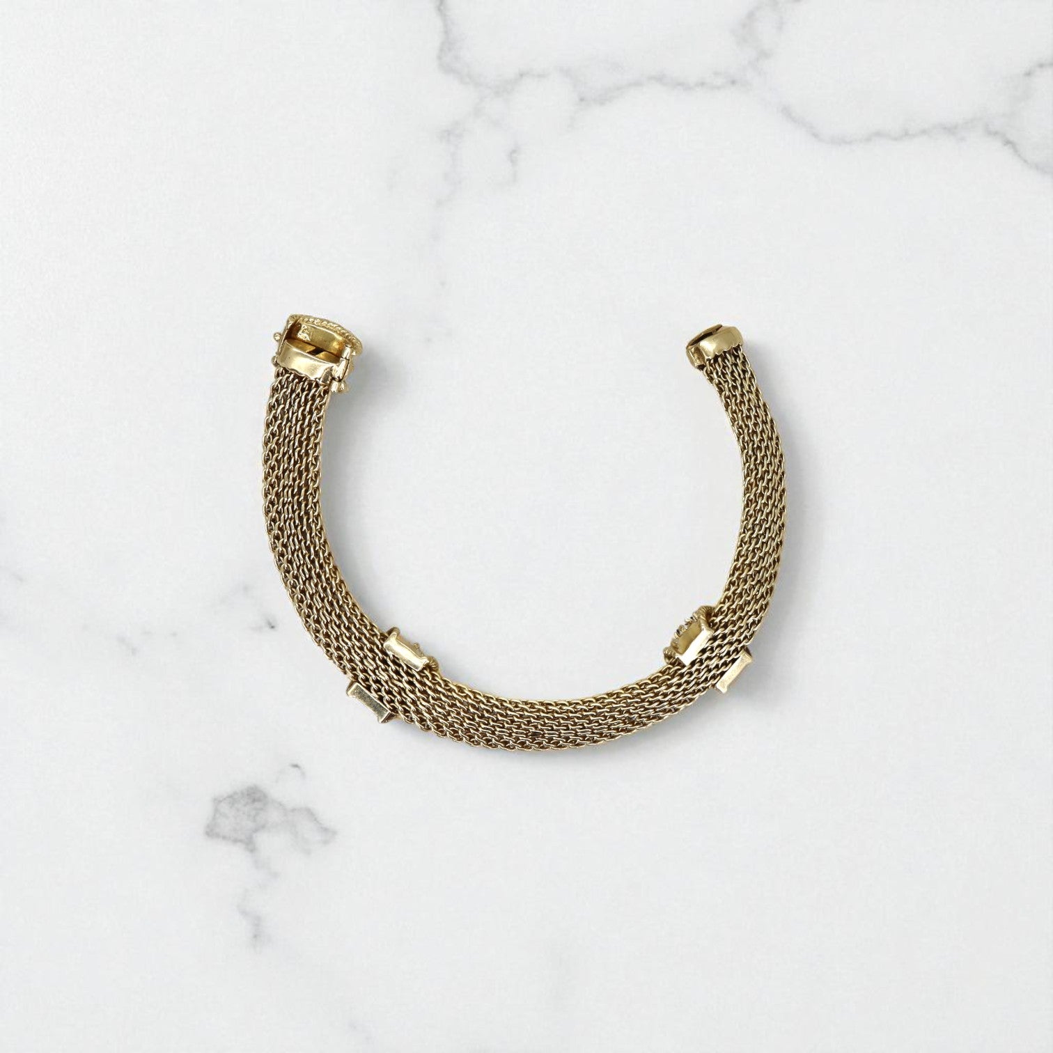Vintage 14k gold mesh weave bracelet from The Vintage Vault, showcasing intricate craftsmanship and classic style.