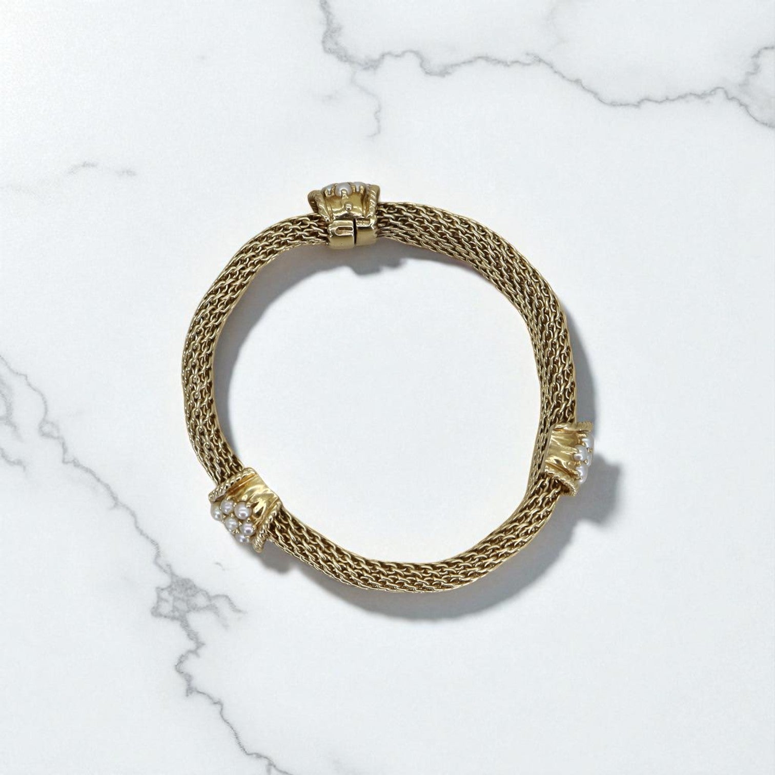 Vintage 14k gold mesh weave bracelet with intricate craftsmanship, showcasing a classic and elegant jewelry design.