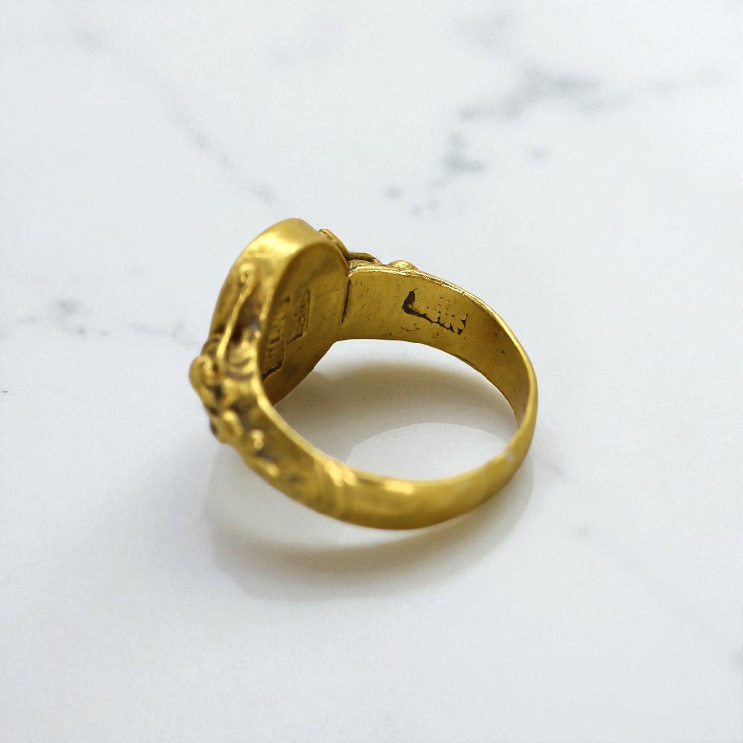 Art Nouveau Chinese Jade ring with 24k gold accents, vintage style, featuring detailed carvings and a smooth jade gemstone.