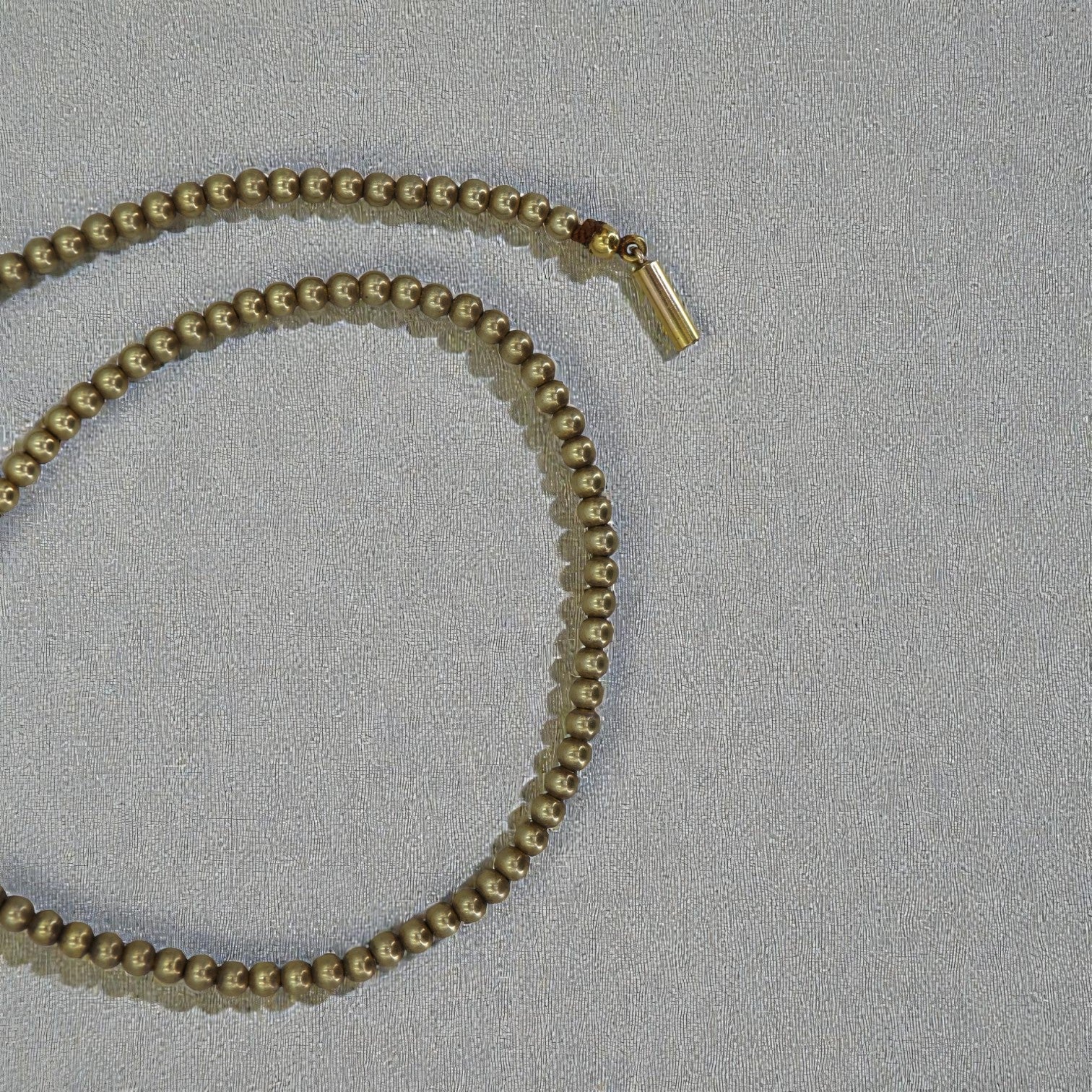 Antique gold-filled bead choker necklace with small round beads, vintage-inspired jewelry from The Vintage Vault.