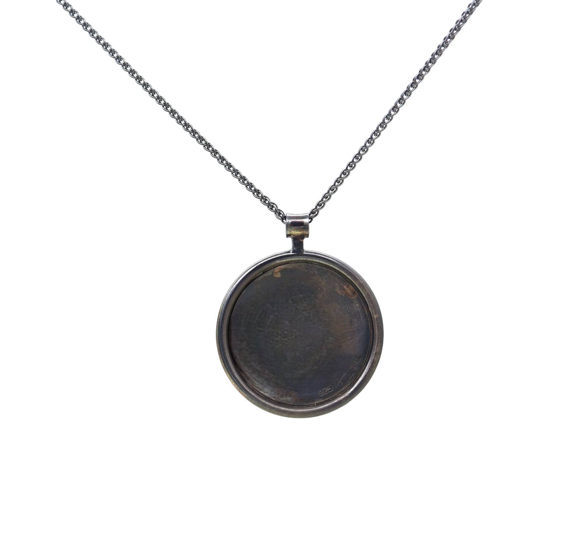 Andrew Zaruba Keum-Boo Celtic Knot pendant featuring intricate gold and silver knot design on a polished pendant.
