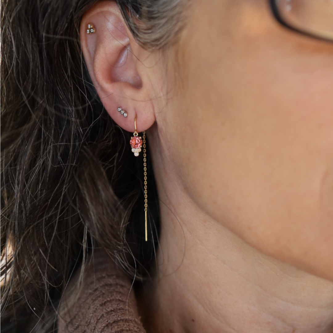 Malayan garnet threader earrings in 14k gold with delicate dangle design, featuring vibrant red garnet stones.