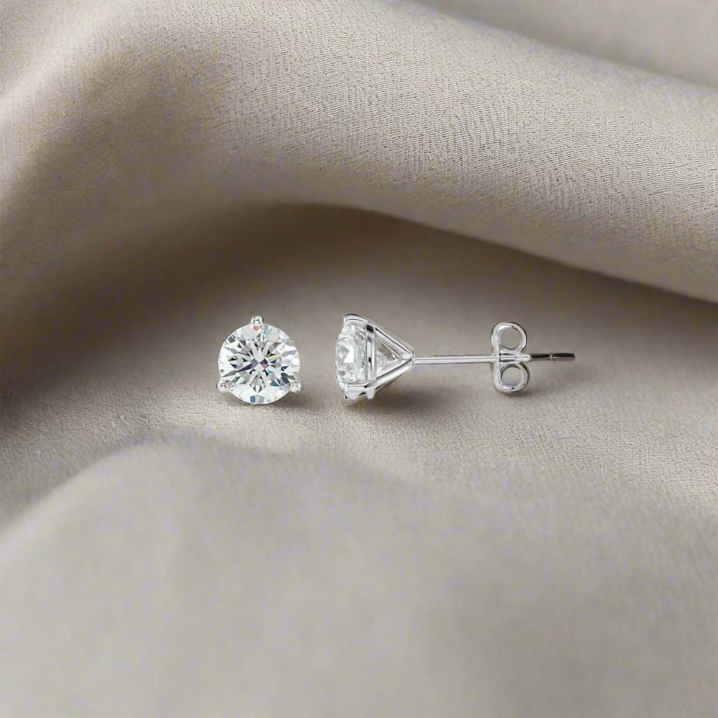 Petra Star Martini diamond stud earrings featuring sparkling round diamonds set in classic jewelry design.