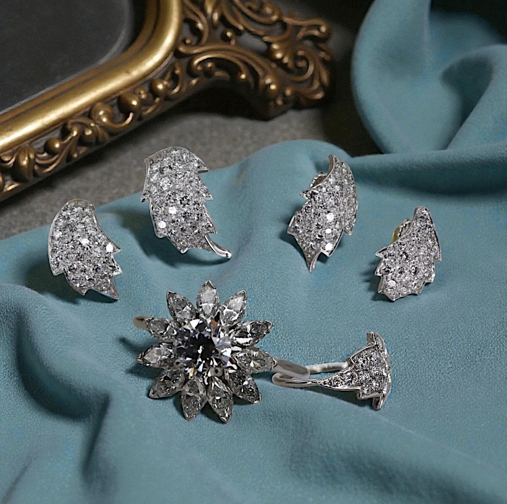 Vintage mid-century platinum and diamond leaf earrings, originally from 1950s brooch, featuring elegant leaf design and sparkling gemstones.