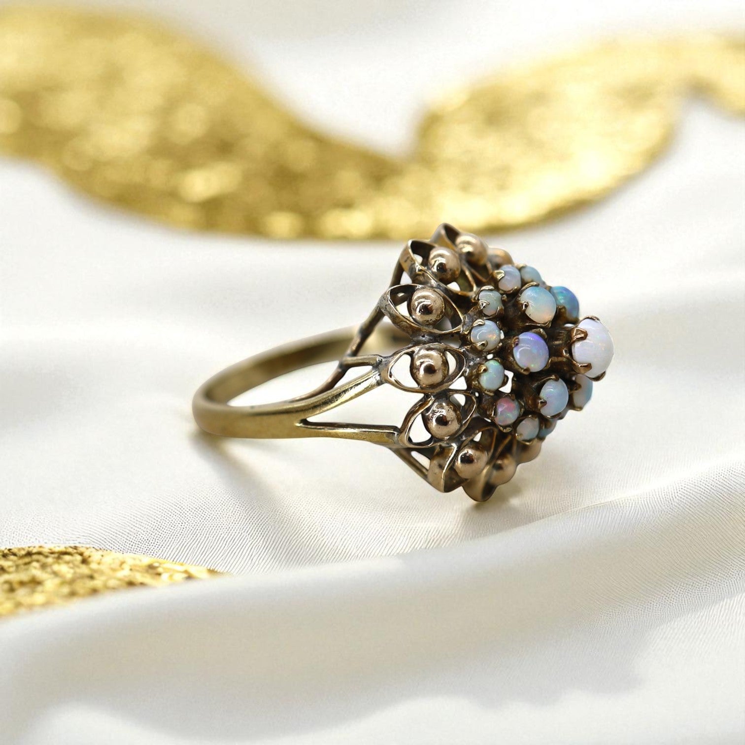 Vintage 1940s white opal cluster harem ring in gold filled jewelry, featuring a bold statement design with October birthstone.