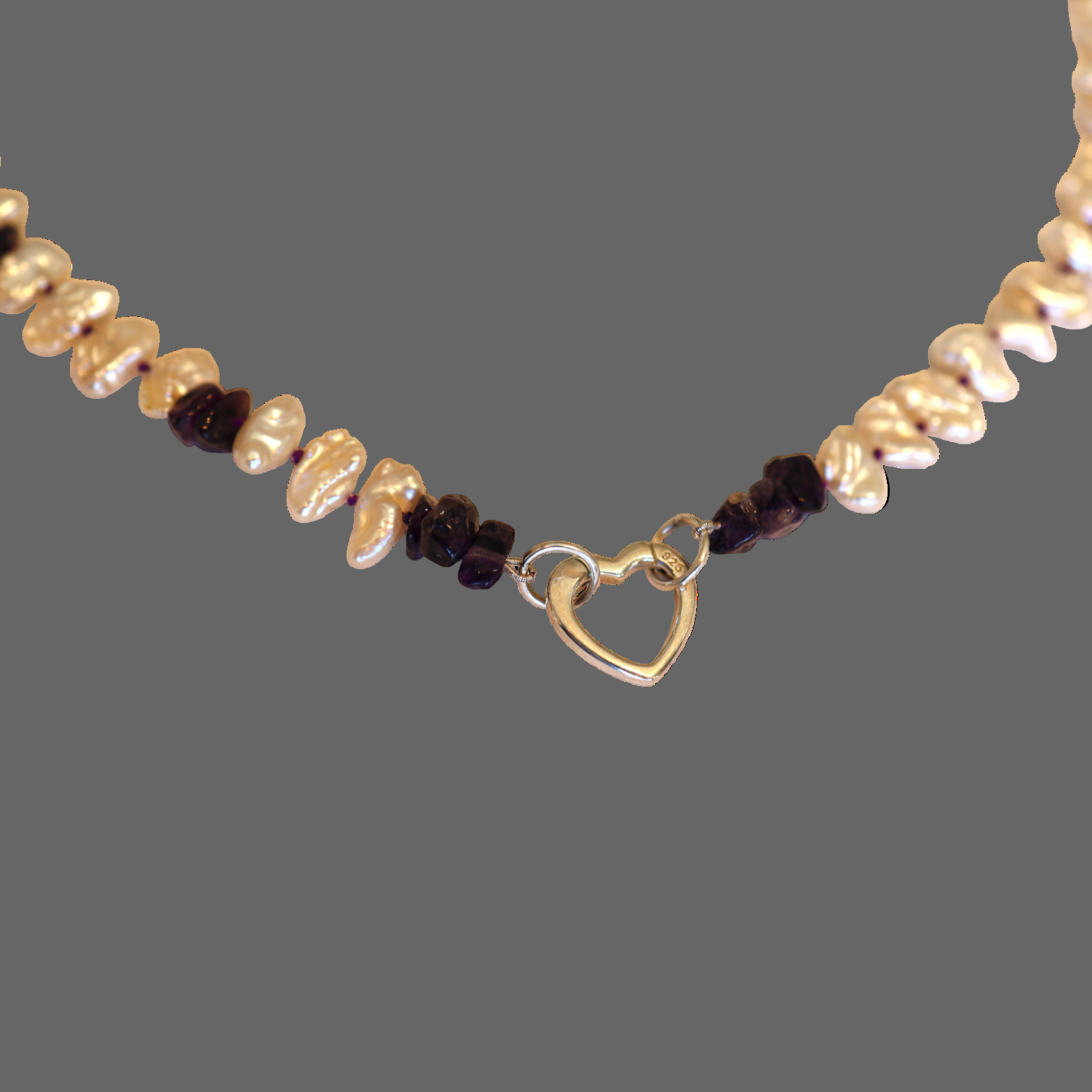 Petra Star amethyst and keshi pearl necklace with silver heart charm holder clasp, showcasing elegant gemstone and pearl details.