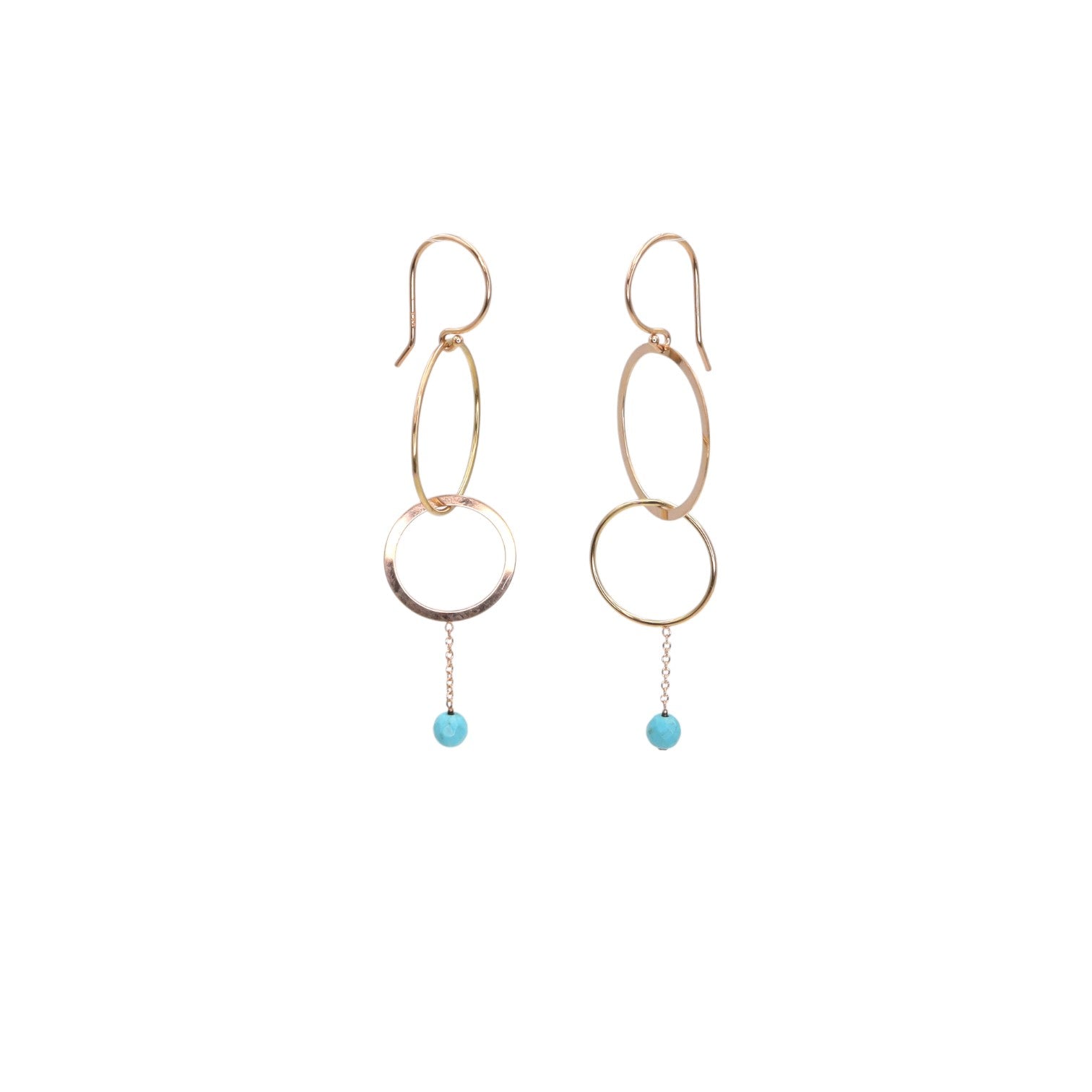 Turquoise hoop earrings by Petra Star featuring round, vibrant turquoise stones in a classic hoop earring design.