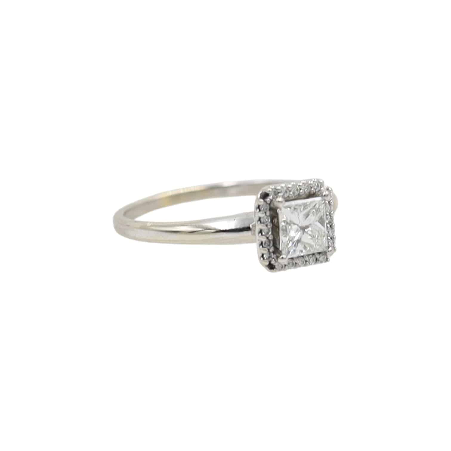 Elegant PS princess-cut diamond halo engagement ring showcasing a sparkling central diamond surrounded by a halo of smaller diamonds.
