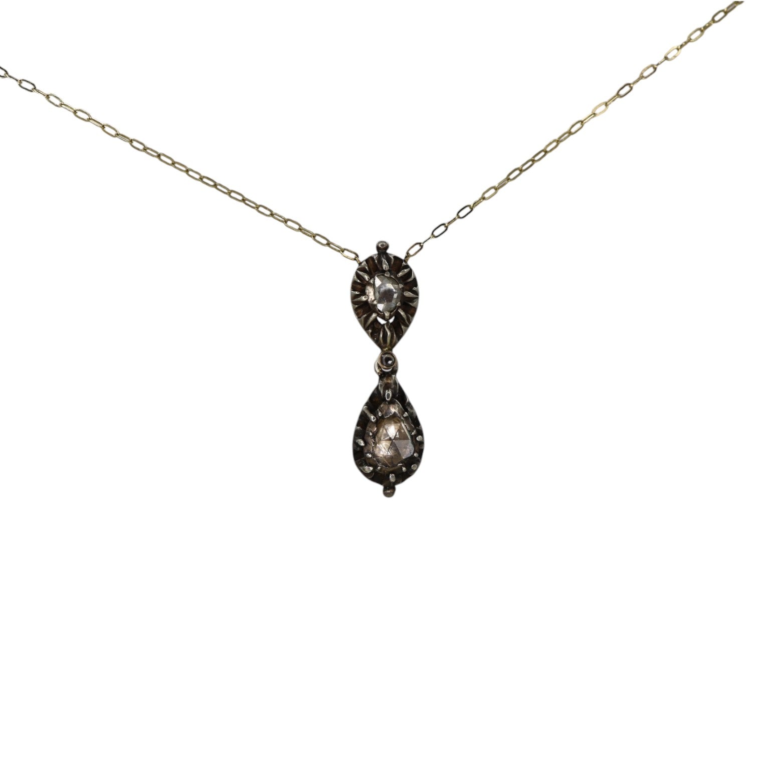 Georgian double-drop rose-cut diamond pendant necklace in silver and 14k gold with intricate vintage design.