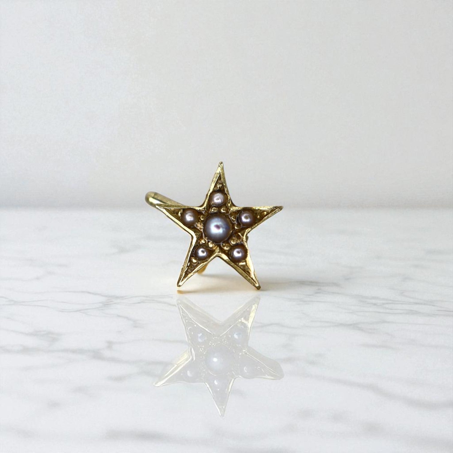 Victorian Star earring single stud with pearls in 14K gold, vintage-inspired jewelry featuring a star design with pearl accents.
