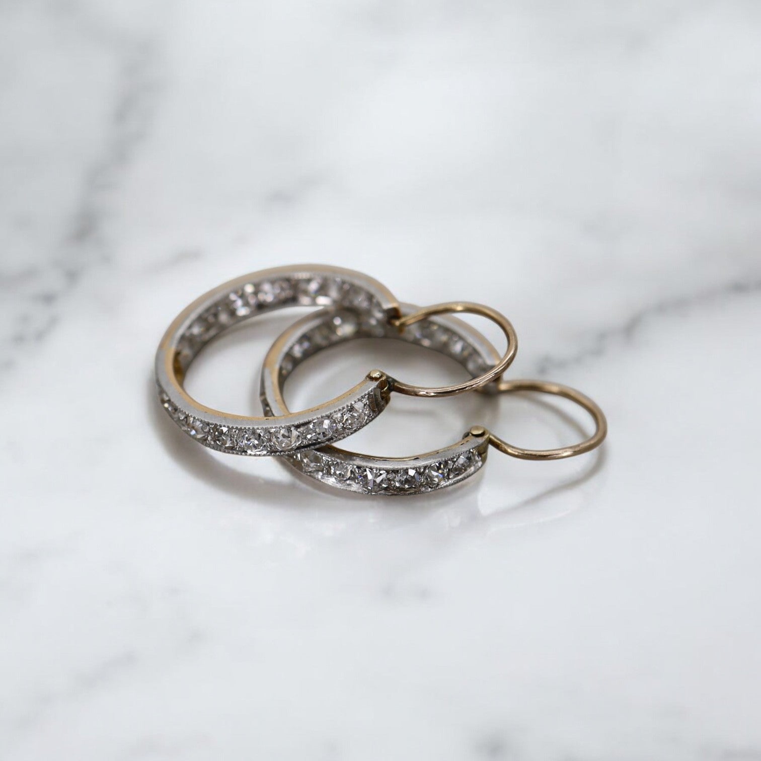 Victorian diamond inside-out hoop earrings featuring intricate vintage design and sparkling diamonds, crafted by The Vintage Vault.