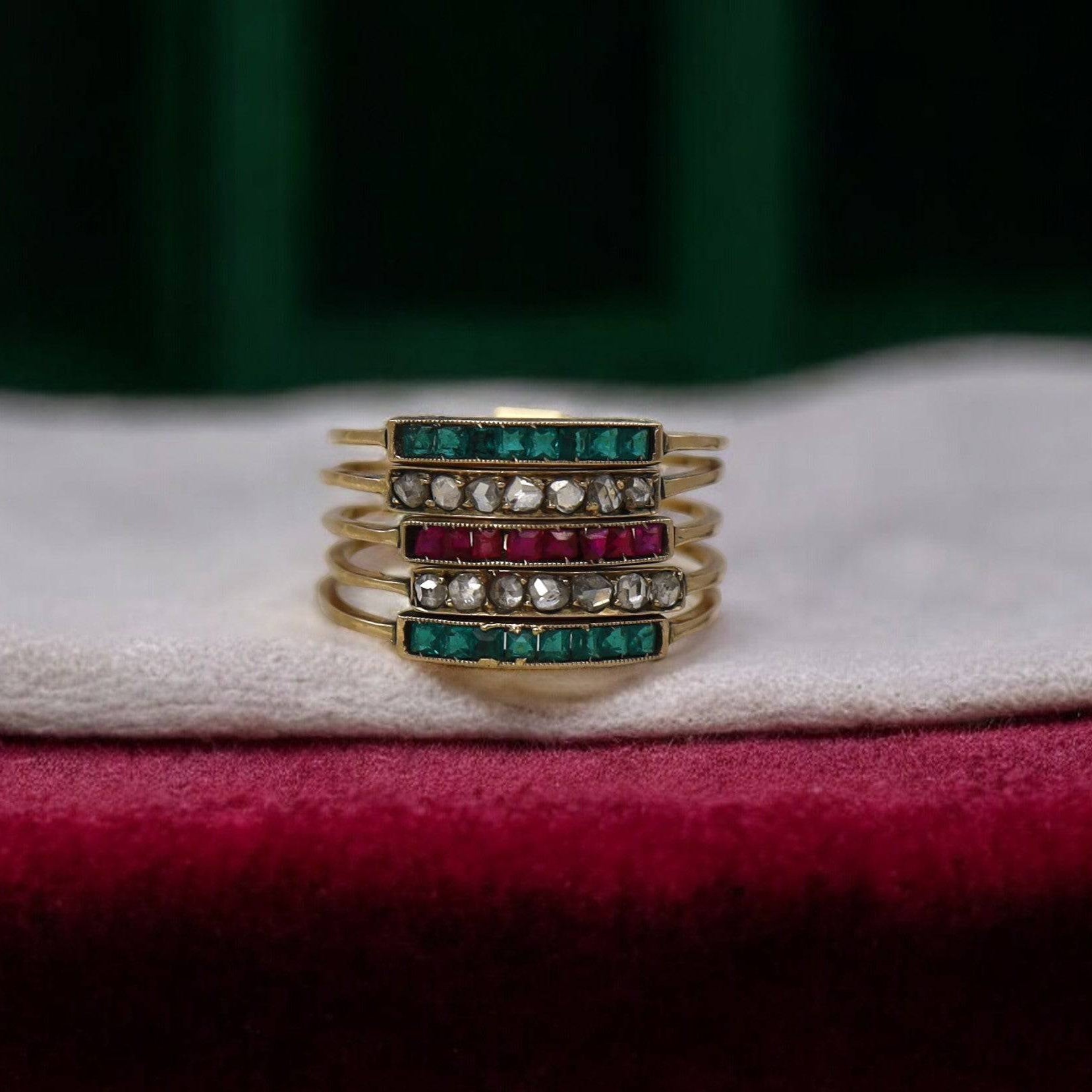Victorian Harem ring in 14k yellow gold with diamonds, rubies, and emeralds, featuring intricate vintage design and gemstone accents