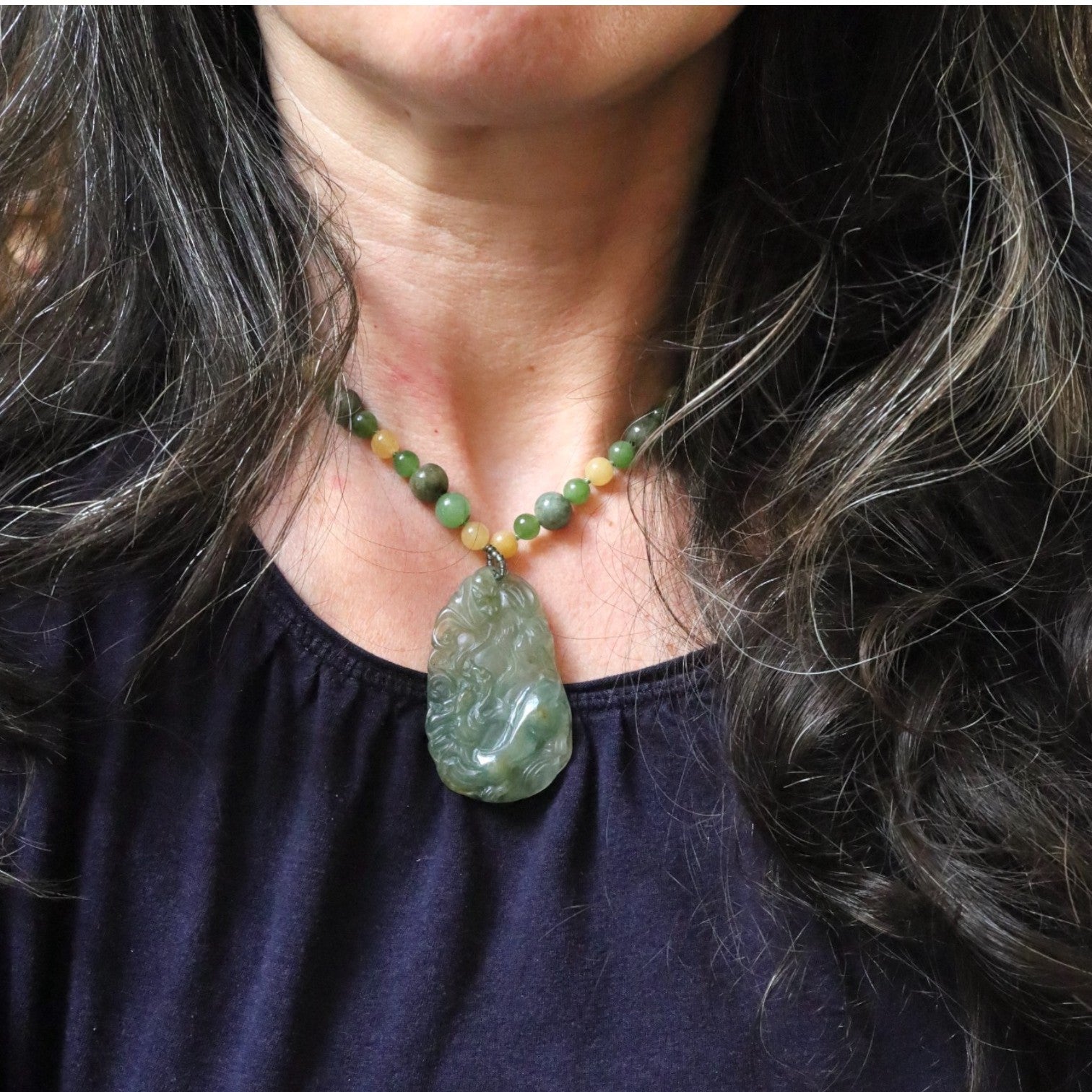 Vintage carved double-sided dragon jade necklace with jade beads, showcasing intricate craftsmanship and traditional design.
