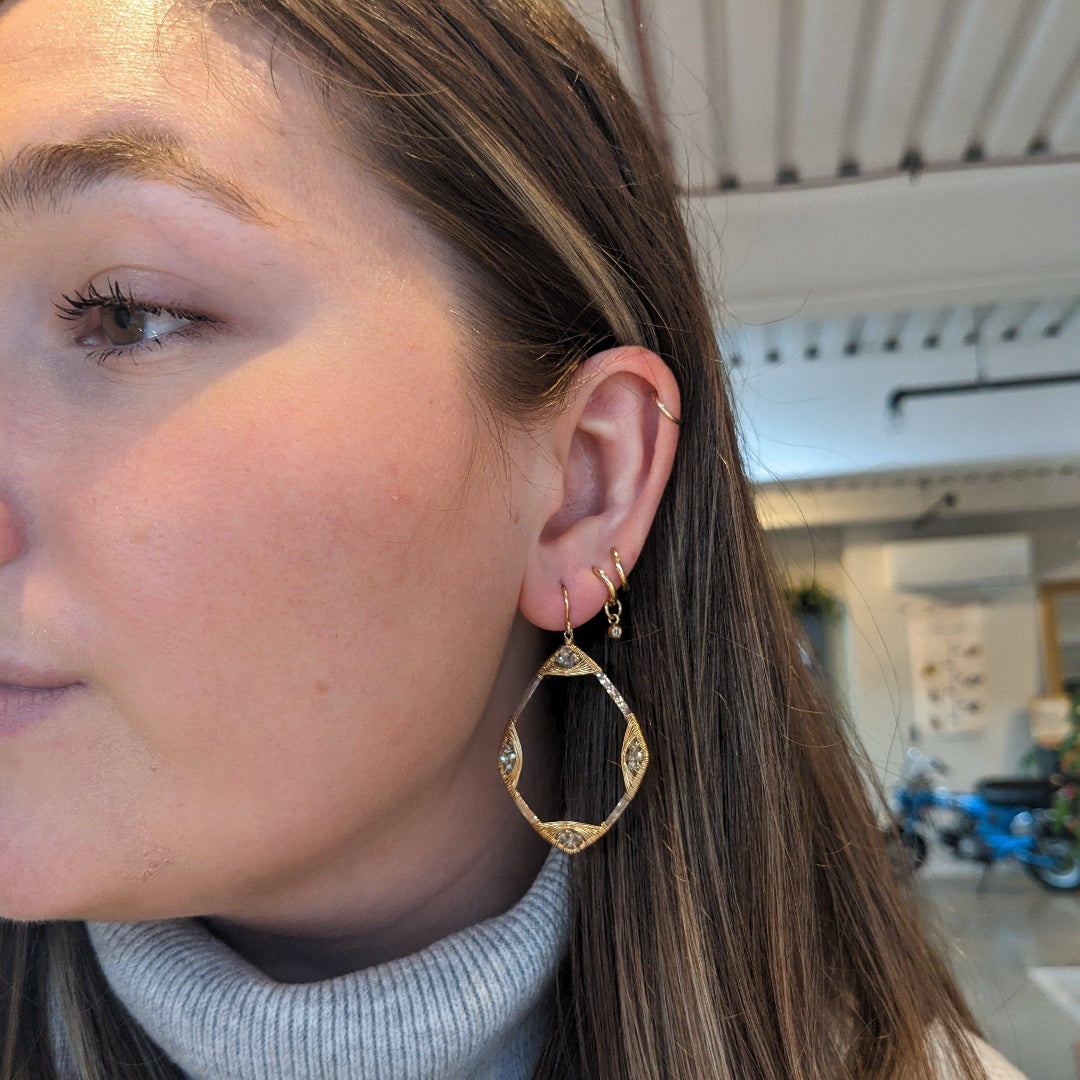 Wire-wrapped crystal earrings by Dana Kellin, featuring elegant four corners design with sparkling crystals.