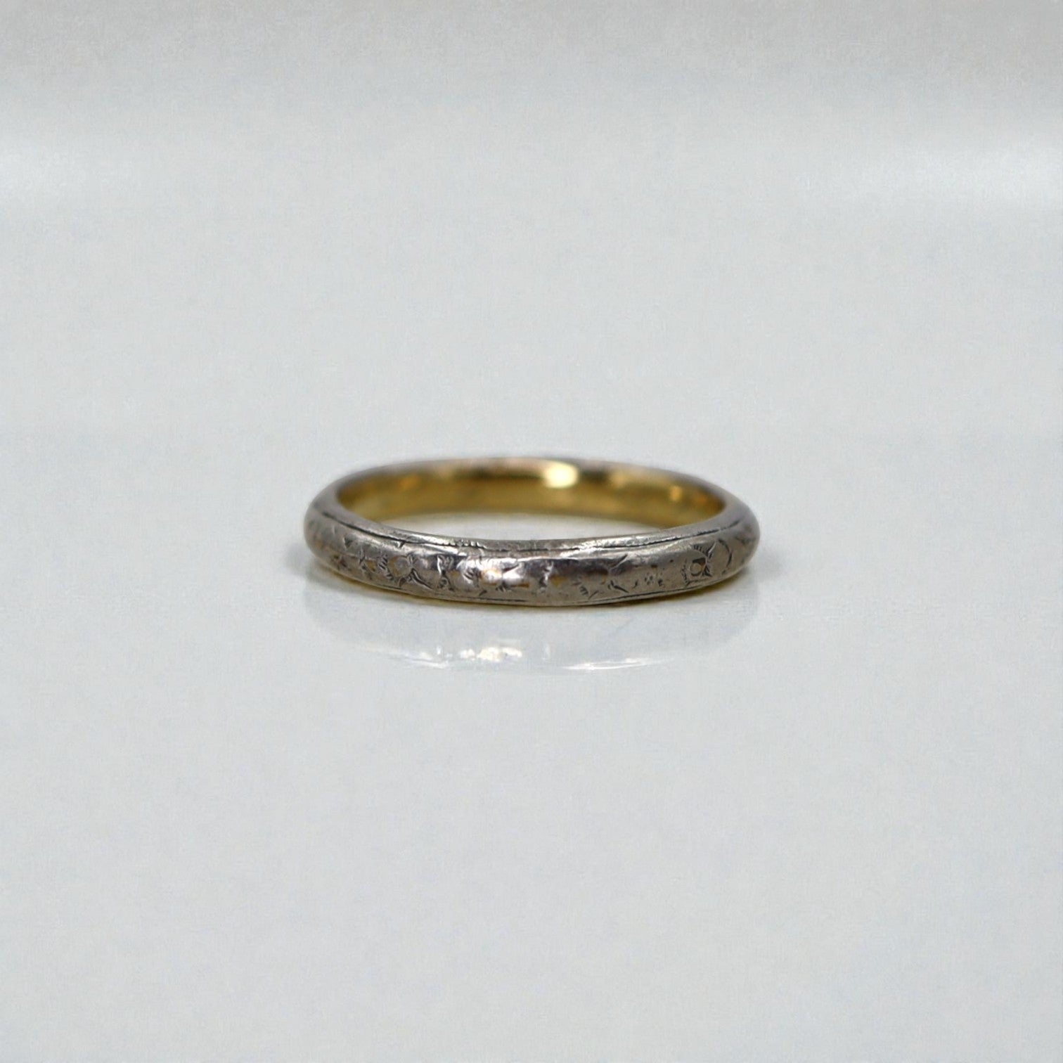 Art Deco band by Wood & Sons in 18k white and yellow gold, 2.2mm wide, showcasing intricate vintage design and craftsmanship.