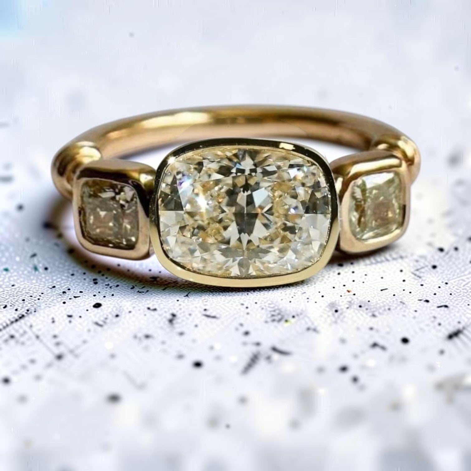 Petra Star 14k gold engagement ring with a 2.08ct lab-grown cushion diamond set east-west, accented by heirloom diamond sides.