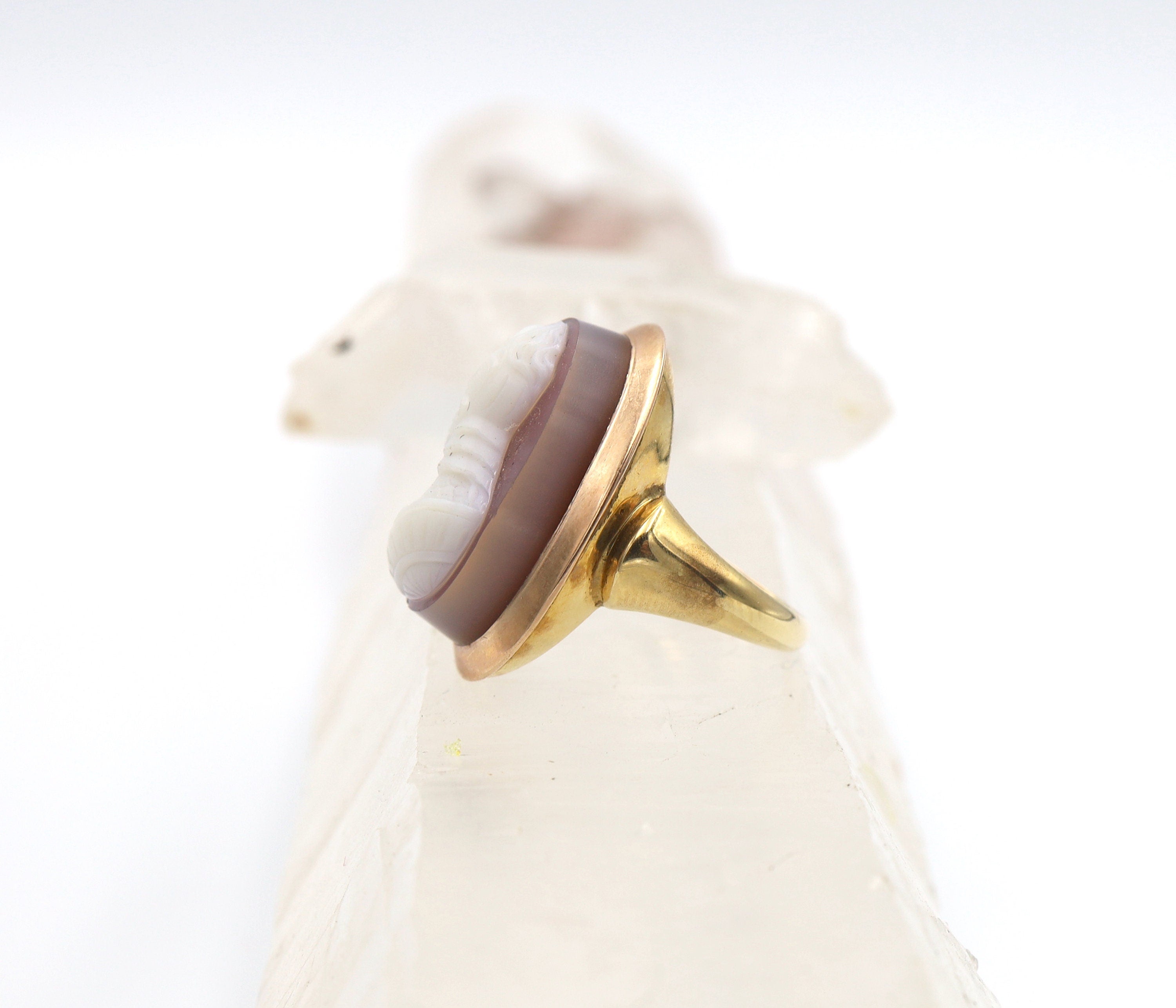 Victorian stone cameo ring with carved agate set in 14k yellow gold, featuring intricate vintage design.