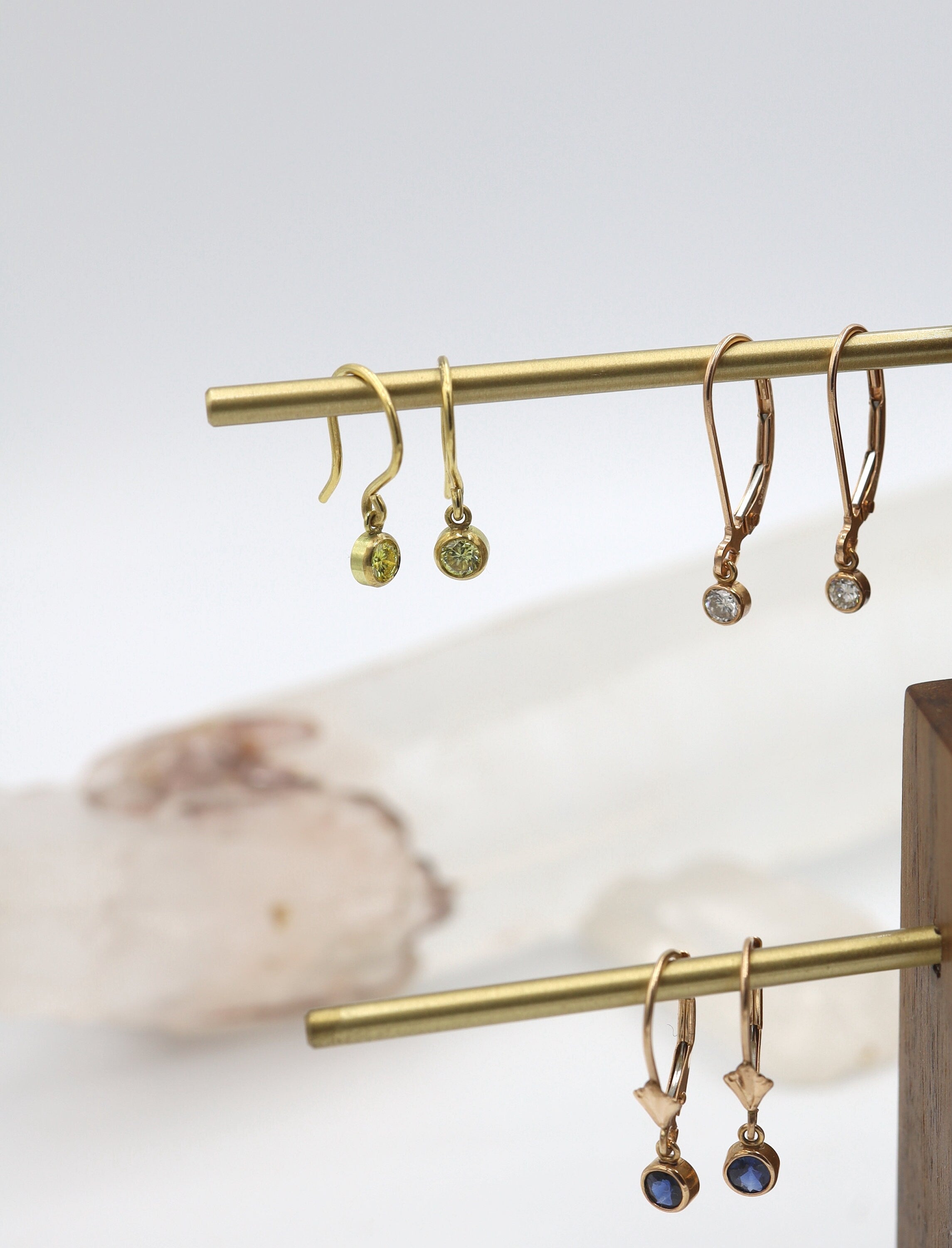 Rose gold sapphire earrings by Petra Star featuring sparkling sapphires set in elegant rose gold hoops.