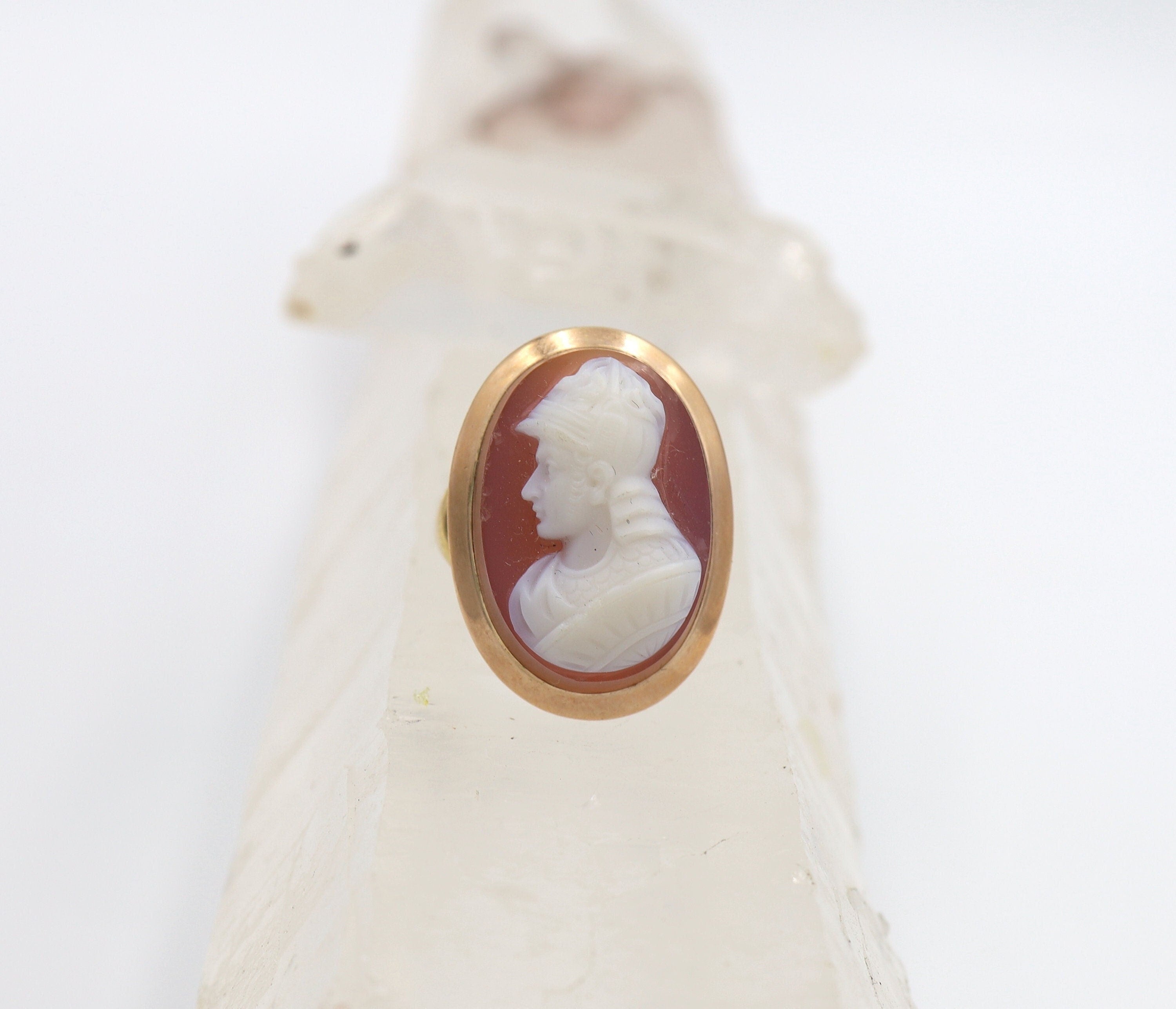 Victorian stone cameo ring with carved agate set in 14k yellow gold, featuring intricate vintage design and detailed craftsmanship.
