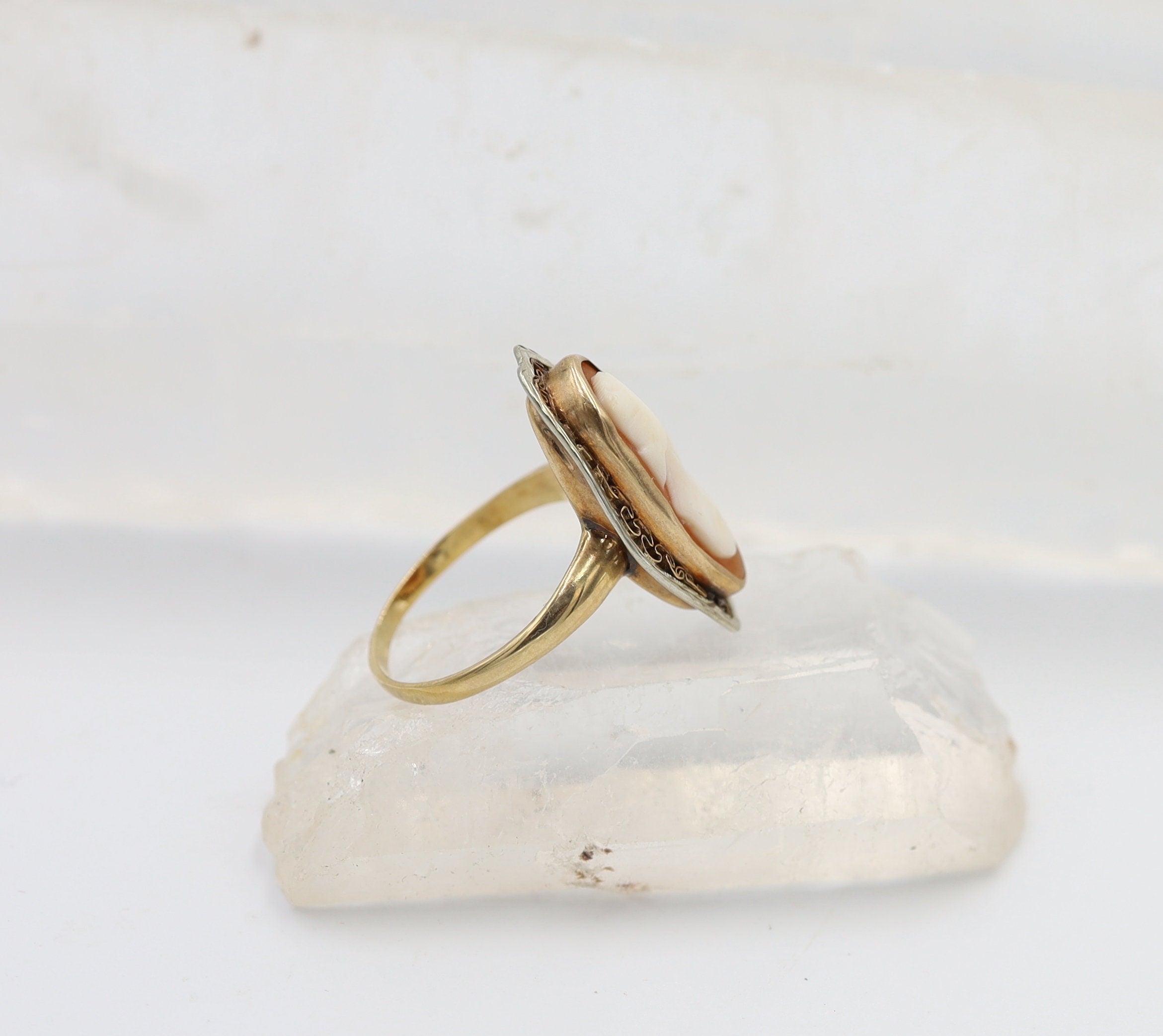 Victorian 10k gold shell cameo ring with intricate cannetille detailing, featuring vintage craftsmanship and elegant design.