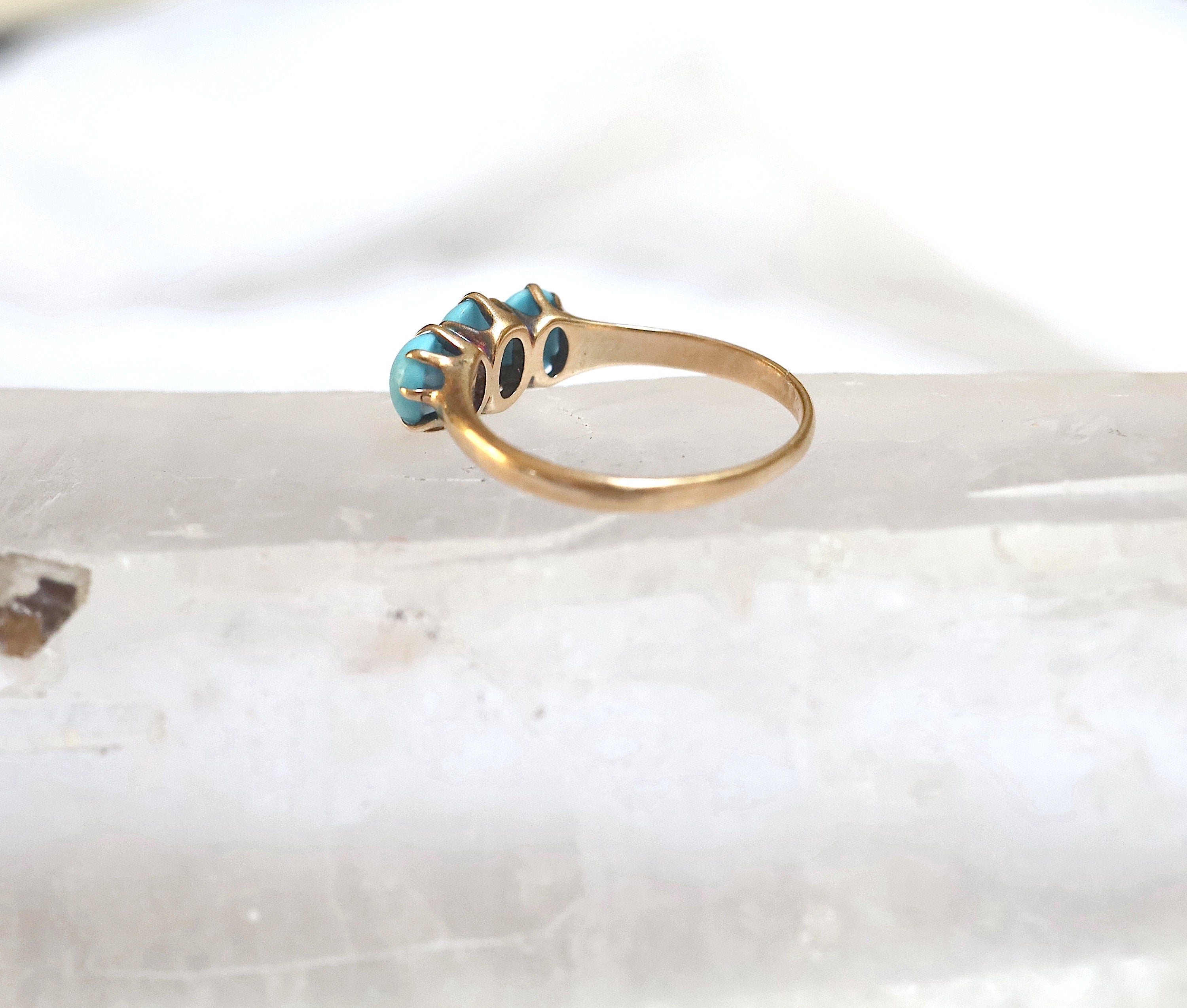 Victorian three-stone turquoise ring by The Vintage Vault featuring a vintage-style silver band and three vibrant turquoise stones.