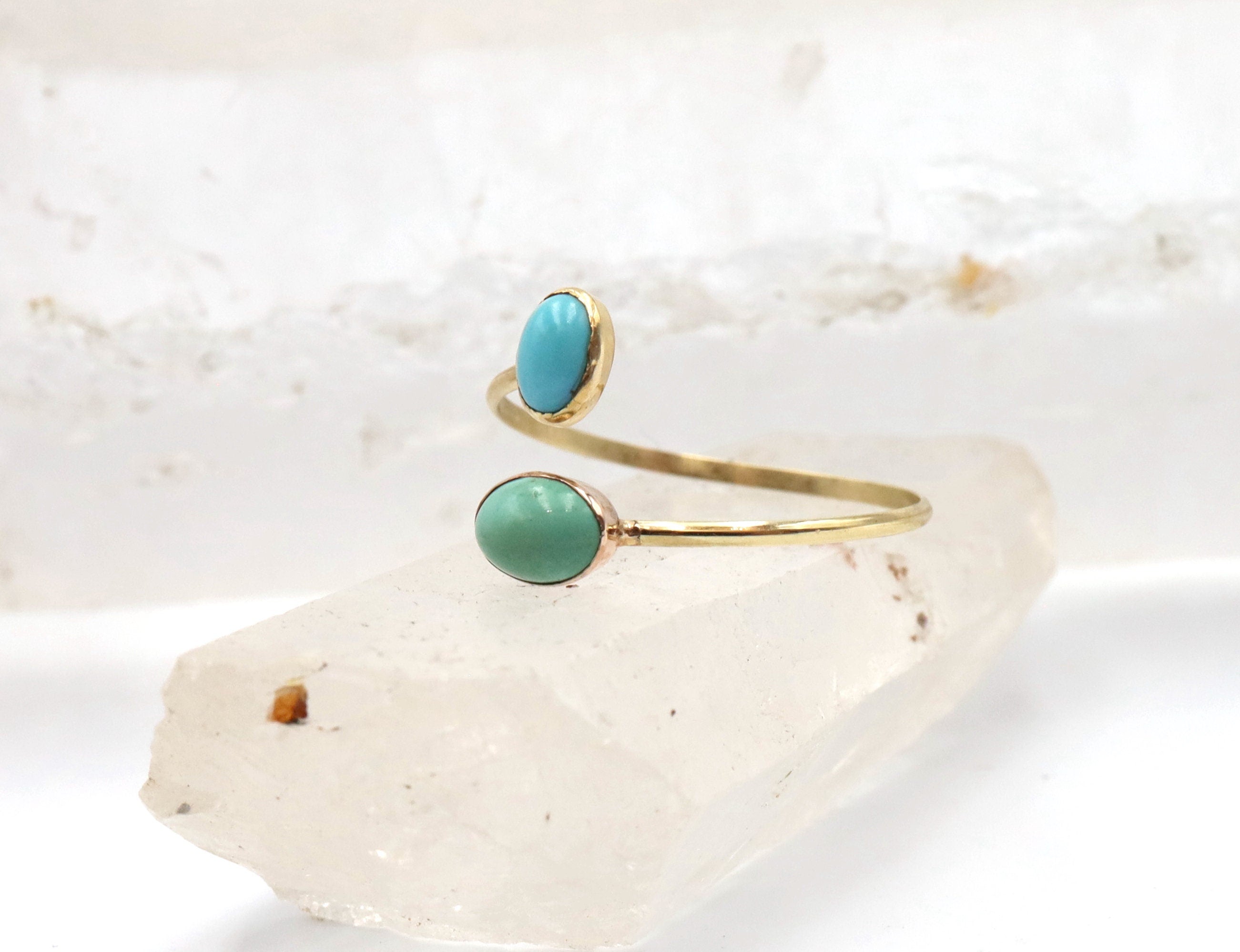 Victorian turquoise Toi et Moi ring by The Vintage Vault featuring two oval turquoise gemstones set in an ornate vintage silver band.
