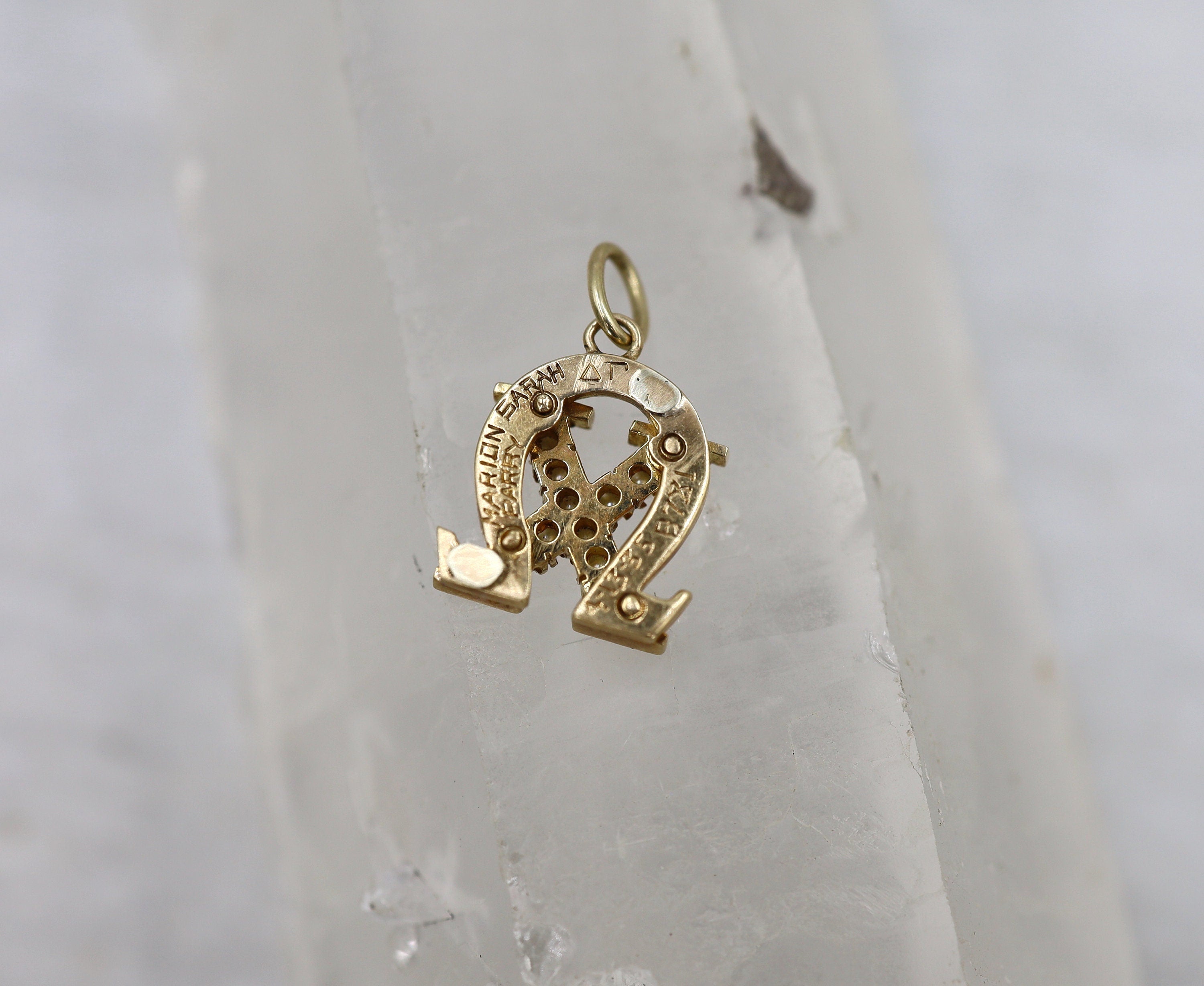 Vintage 1940s 14k gold sorority charm pendant with intricate design, reflecting classic style and historical elegance.